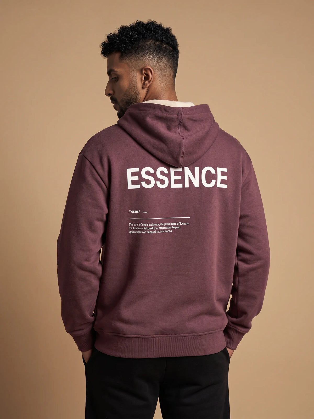 Plum heavyweight hoodie in organic cotton, Unidentity Soul Hoodie, back view of the white ESSENCE print worn by man, 390gsm streetwear from Dubai #color_plum