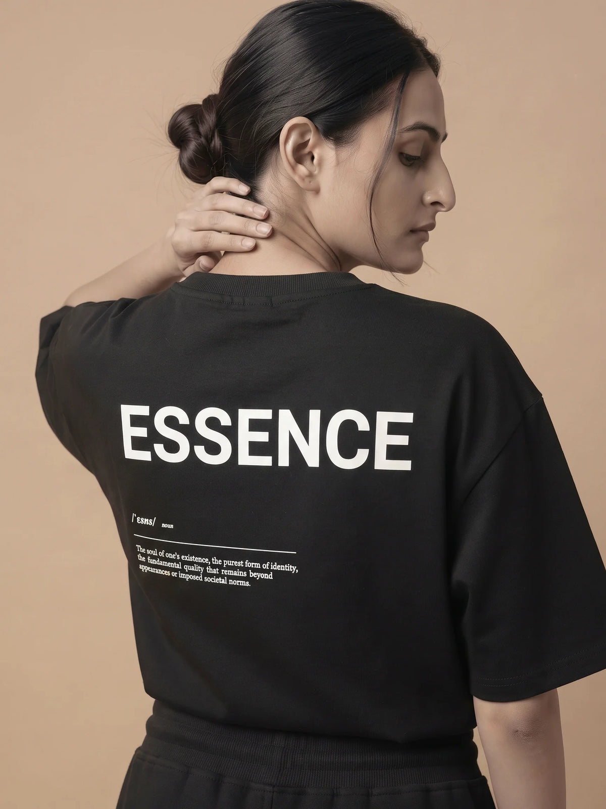 Black heavyweight oversized t-shirt in organic cotton, Unidentity Soul Tee, back close-up of the ESSENCE print on woman, streetwear from Dubai #color_black