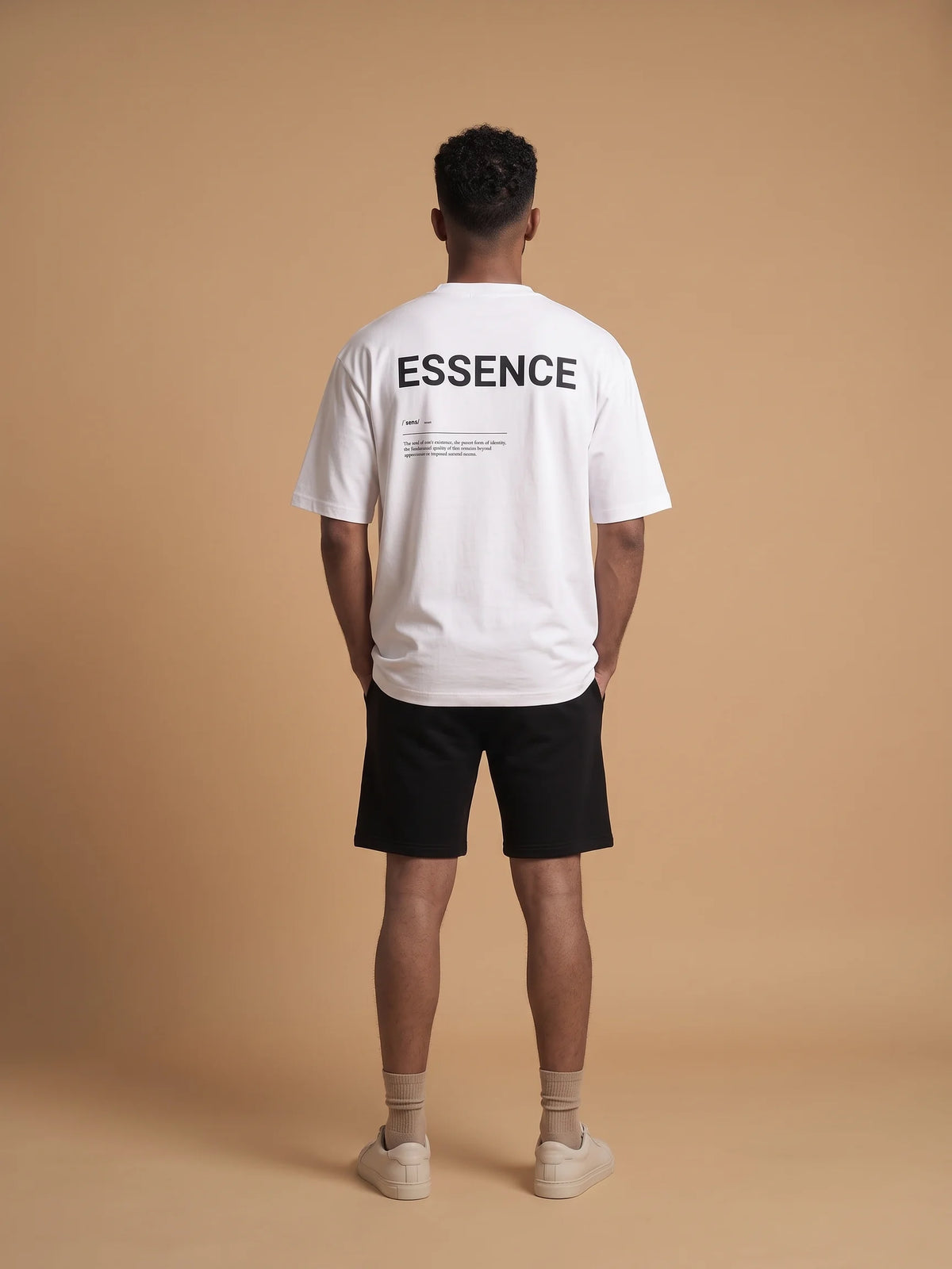 White heavyweight oversized t-shirt in organic cotton, Unidentity Soul Tee, full-length back view of the black ESSENCE print on man, UAE streetwear #color_white