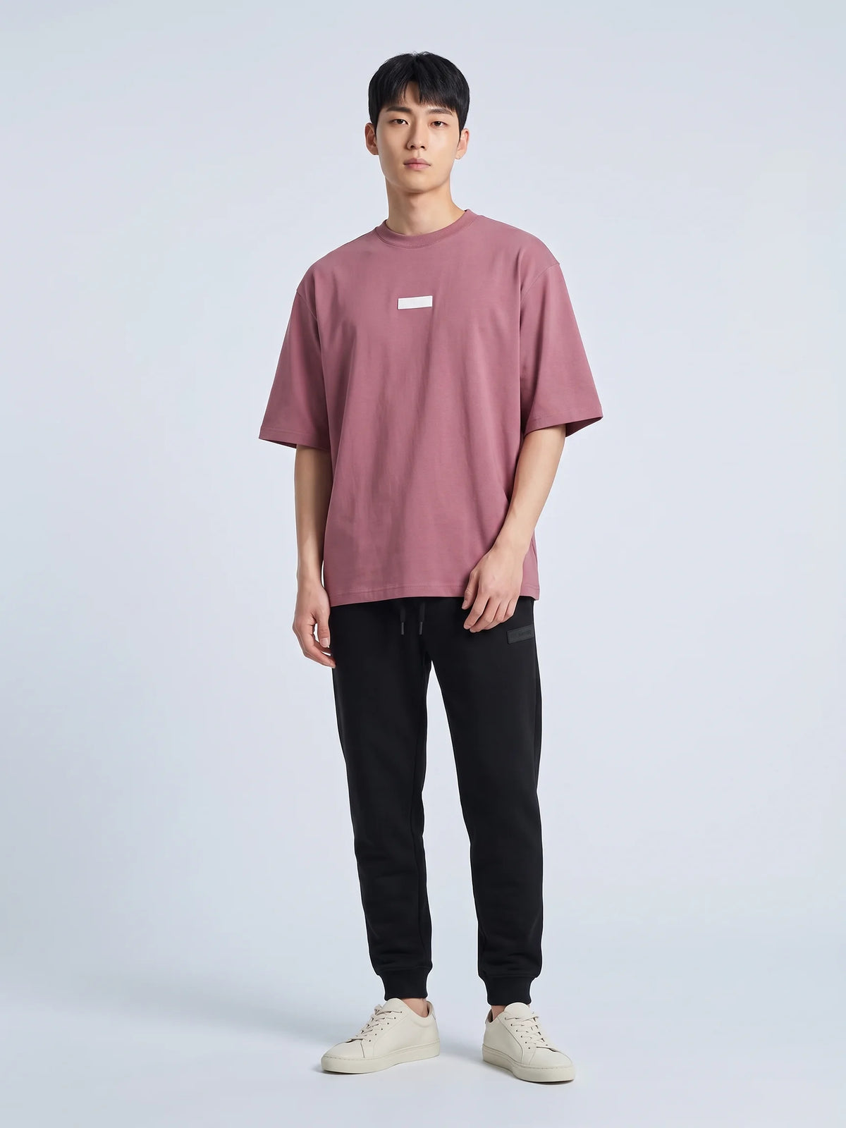 Plum organic cotton t-shirt, Unidentity Identity Oversized Tee, full-length front view with 3D chest patch worn by man, UAE streetwear #color_plum