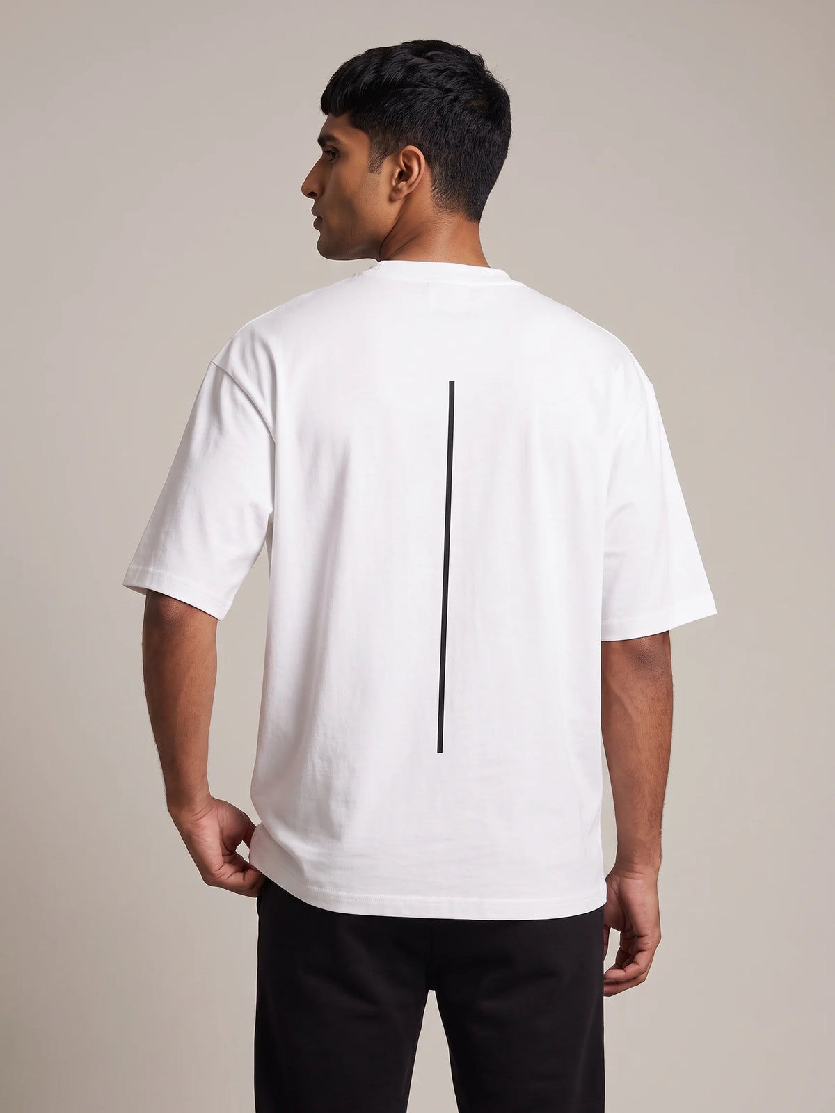 White heavyweight oversized t-shirt in organic cotton, Unidentity Trace Tee, close back view of the black vertical line print, Dubai streetwear #color_white