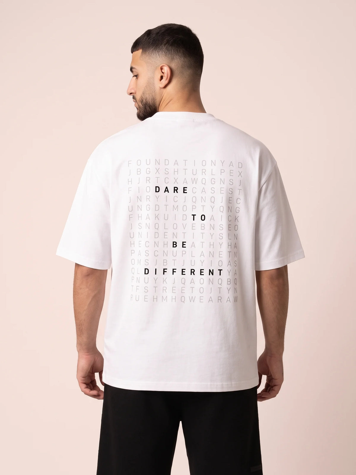 White heavyweight oversized t-shirt in organic cotton, Unidentity Dare Tee, close back view of the DARE TO BE DIFFERENT print, Dubai streetwear #color_white