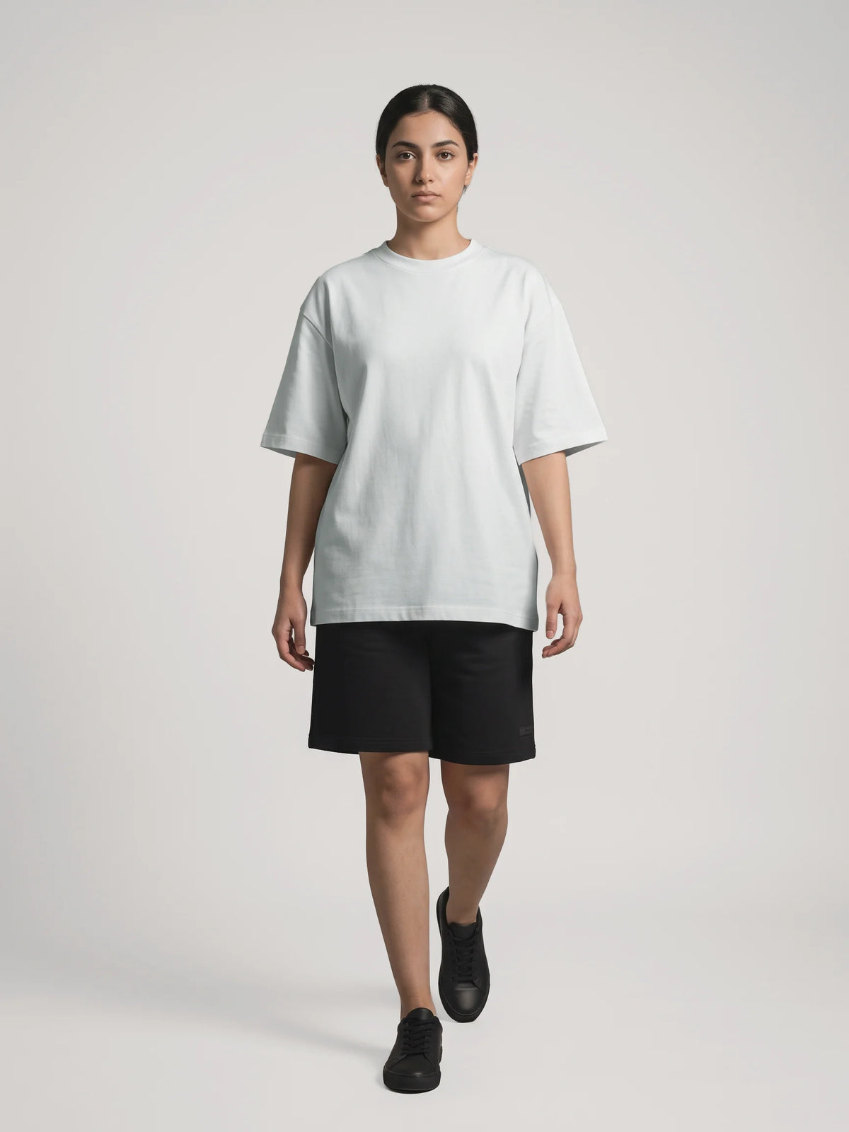 Gray heavyweight oversized t-shirt, Unidentity You Tee, full-length front view of a woman walking in black Core shorts, 210gsm #color_gray