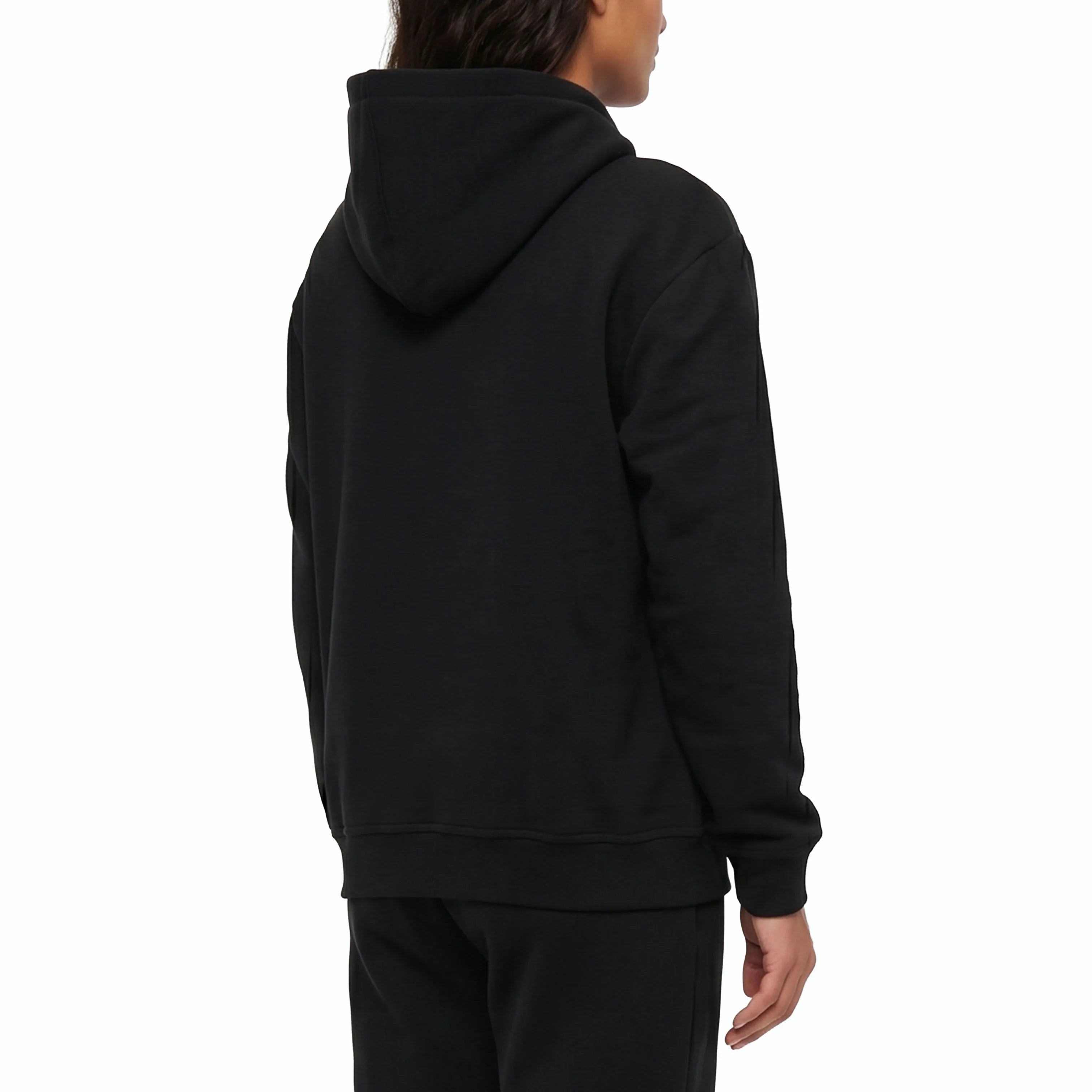 Black hoodie and pants on model. #color_black