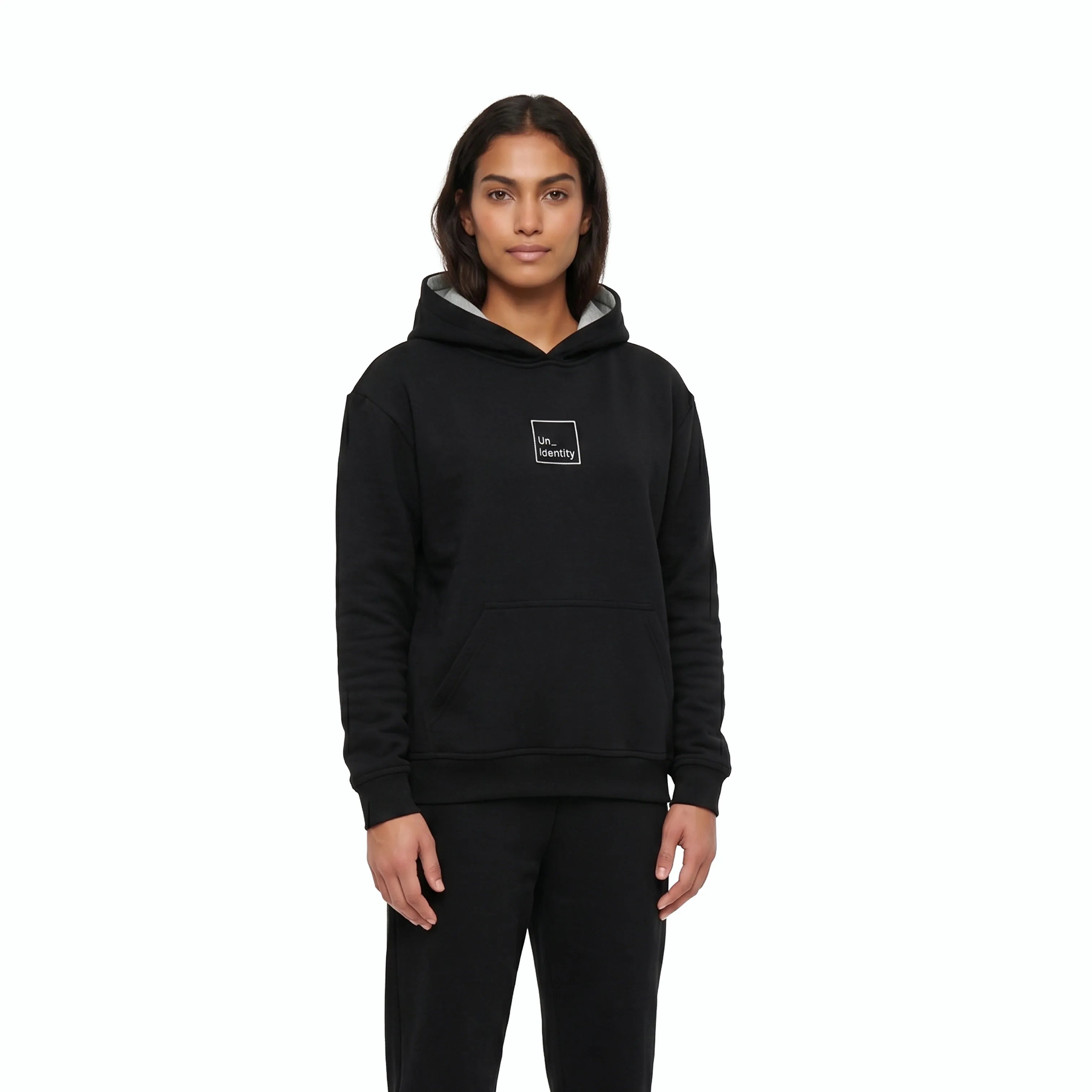 Woman wearing black hoodie with white Unidentity logo on the chest. #color_black