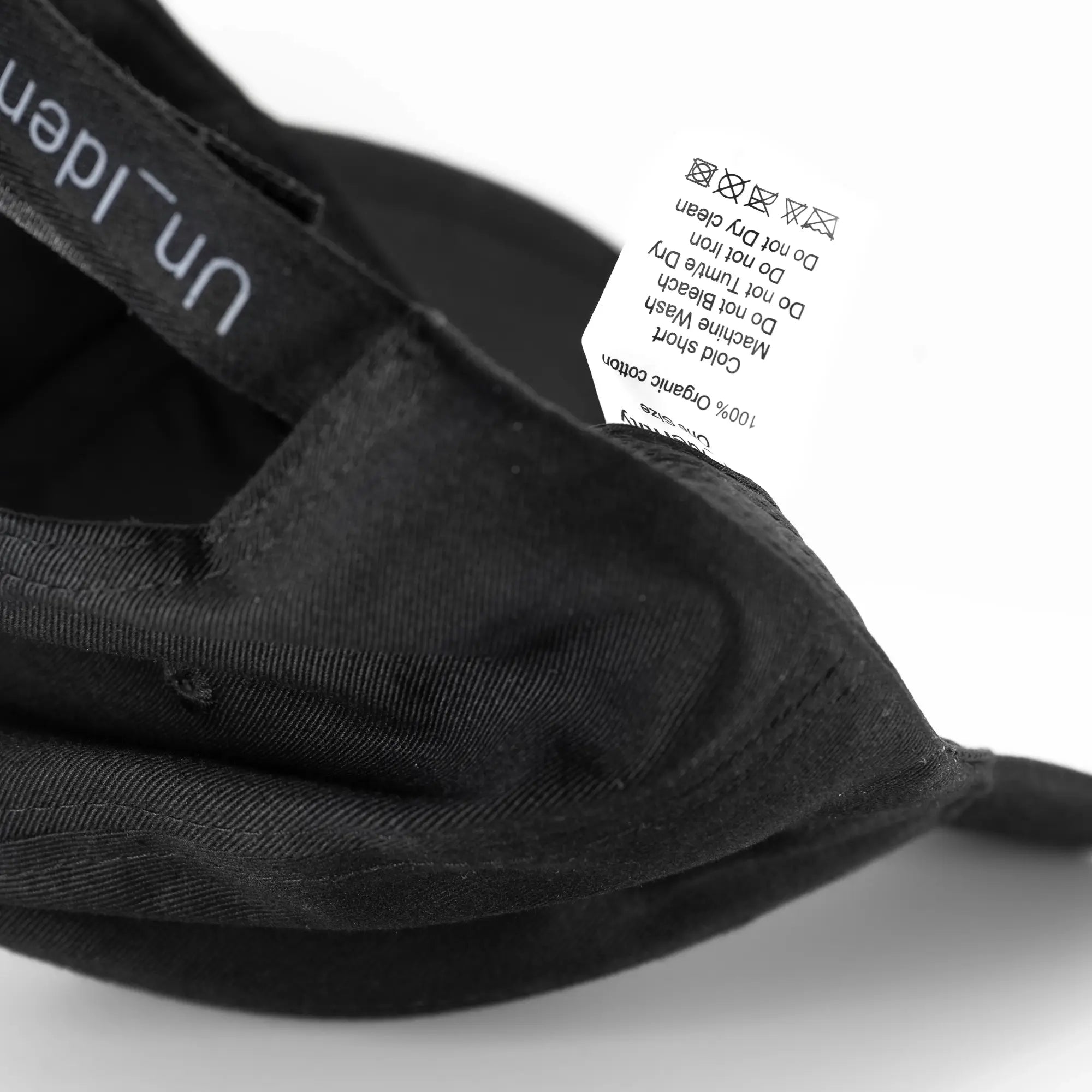 Black cap with product label