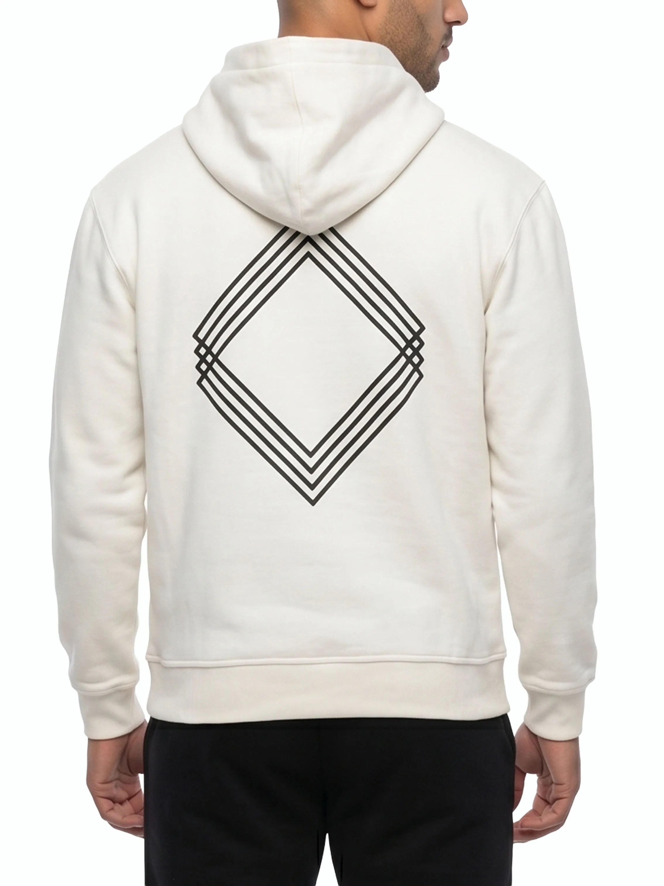 Person wearing white hoodie with black geometric design on the back. #color_white