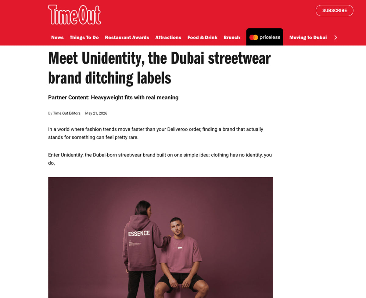 Time Out article about Unidentity, a Dubai streetwear brand, with two people wearing hoodies on a plum background.