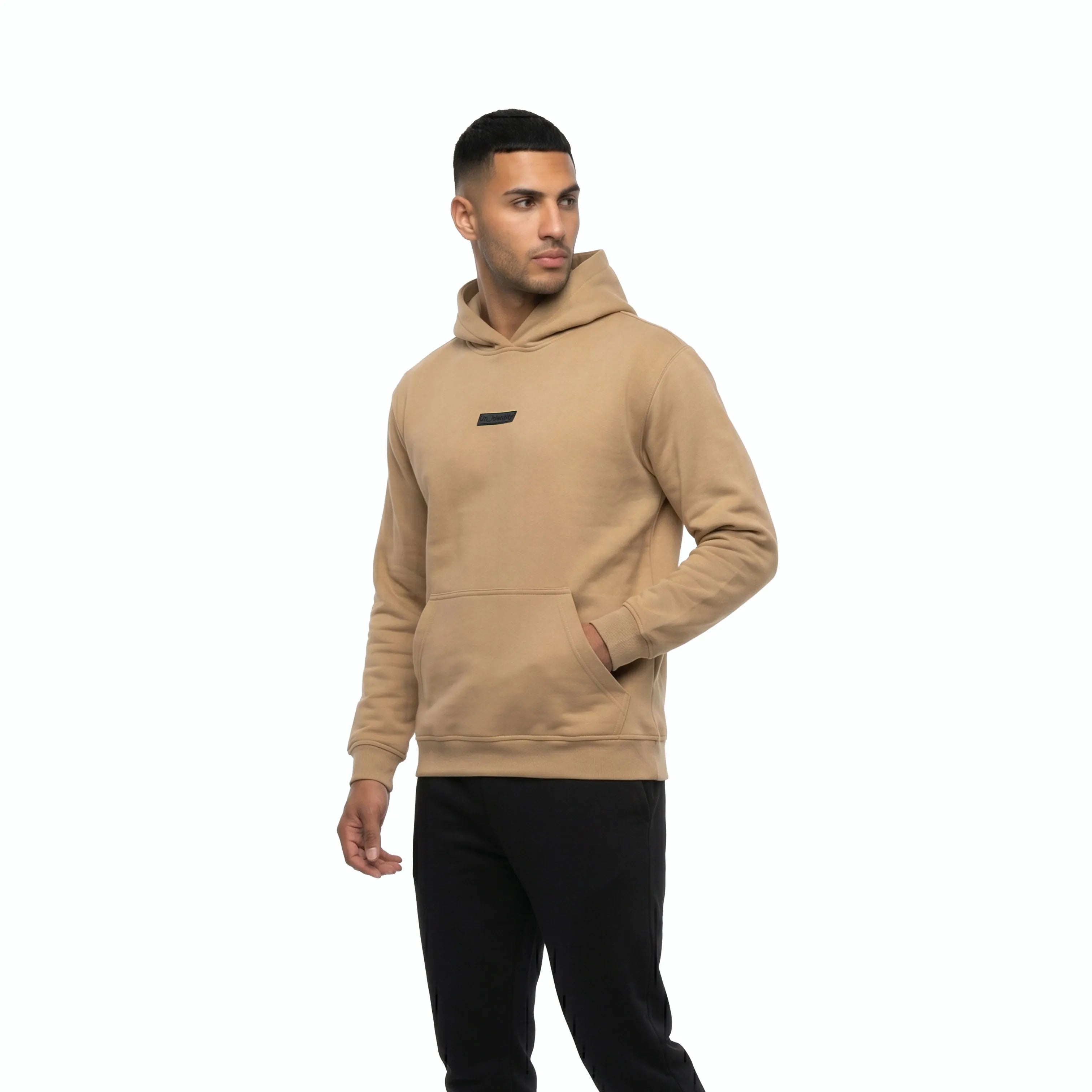 Man wearing beige Unidentity hoodie and black pants. #color_beige