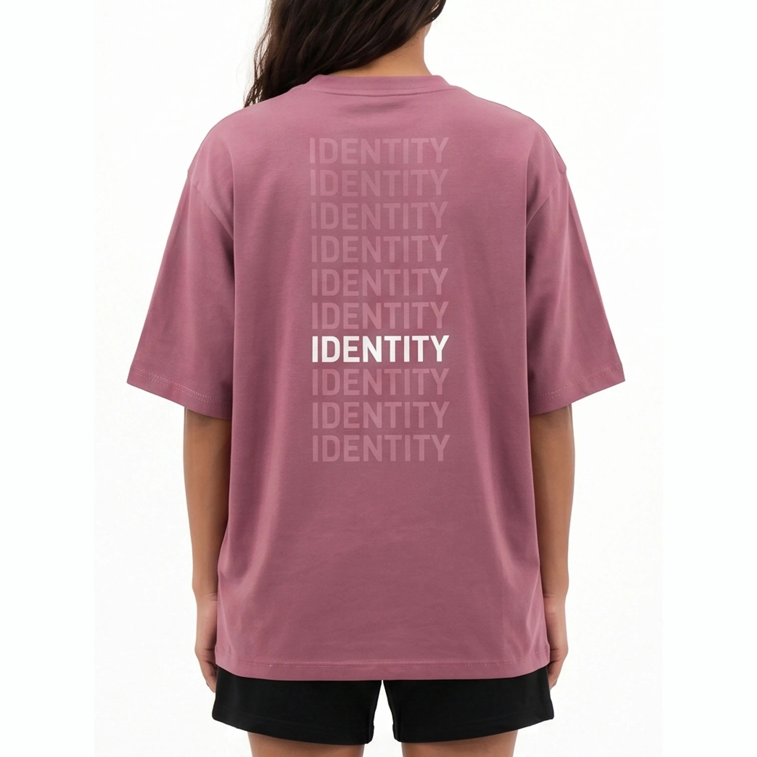 Person wearing plum Unidentity T-shirt with identity printed on the back. #color_plum