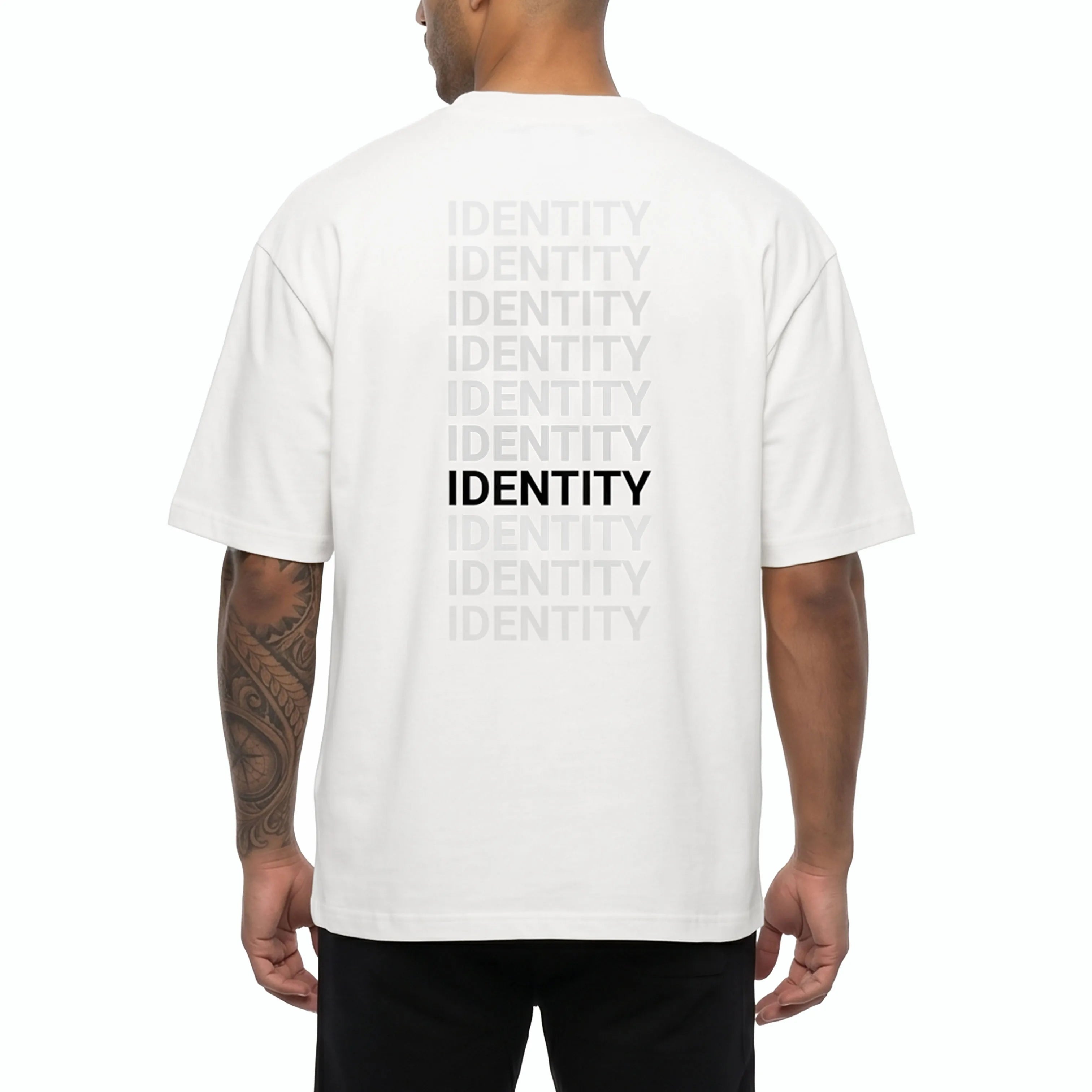 Person wearing white Unidentity T-shirt with identity printed on the back. #color_white