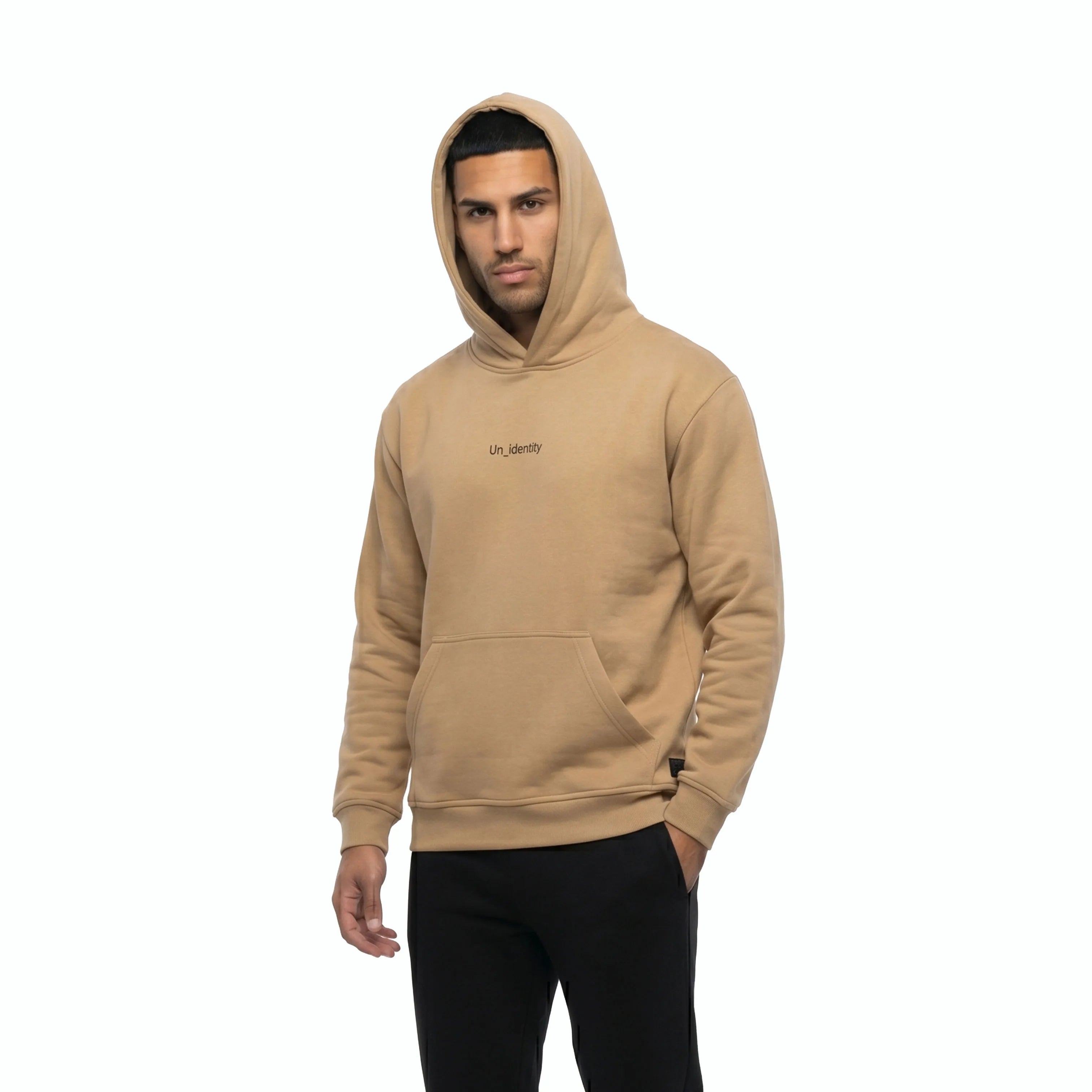 Man wearing beige hoodie and black pants. #color_beige