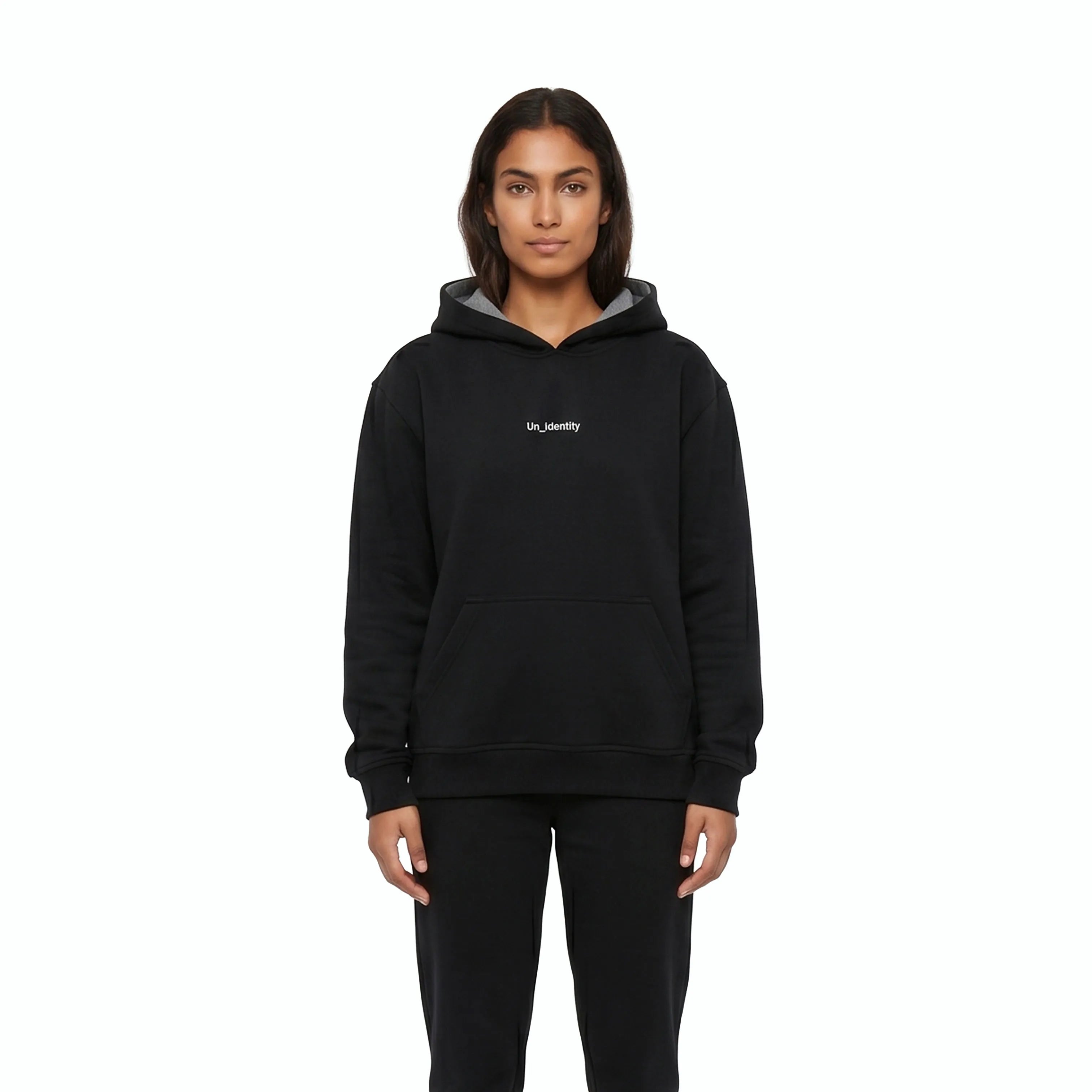 Woman wearing black hoodie and black pants. #color_black