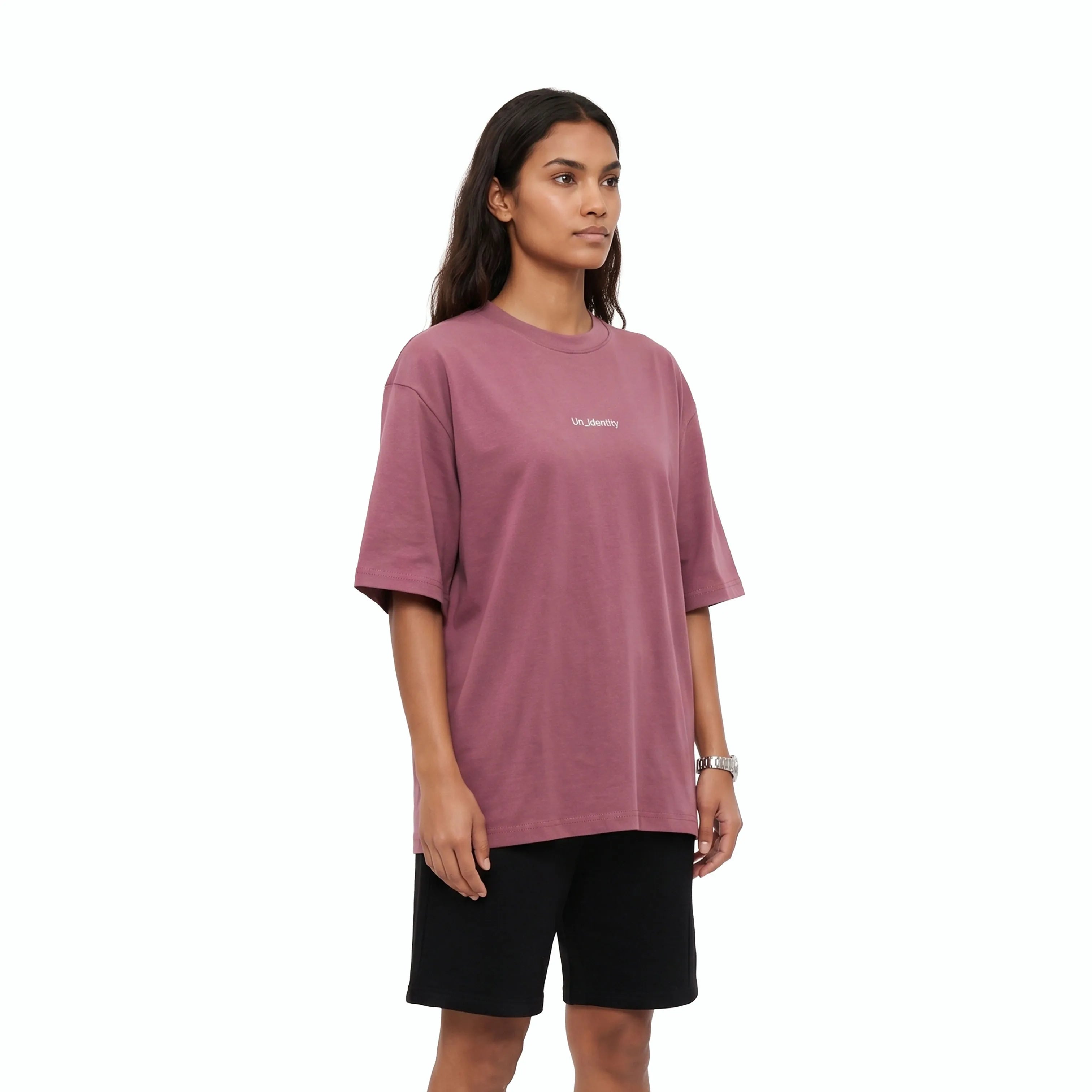 Model wearing plum tee with Unidentity logo on the chest and black shorts. #color_plum