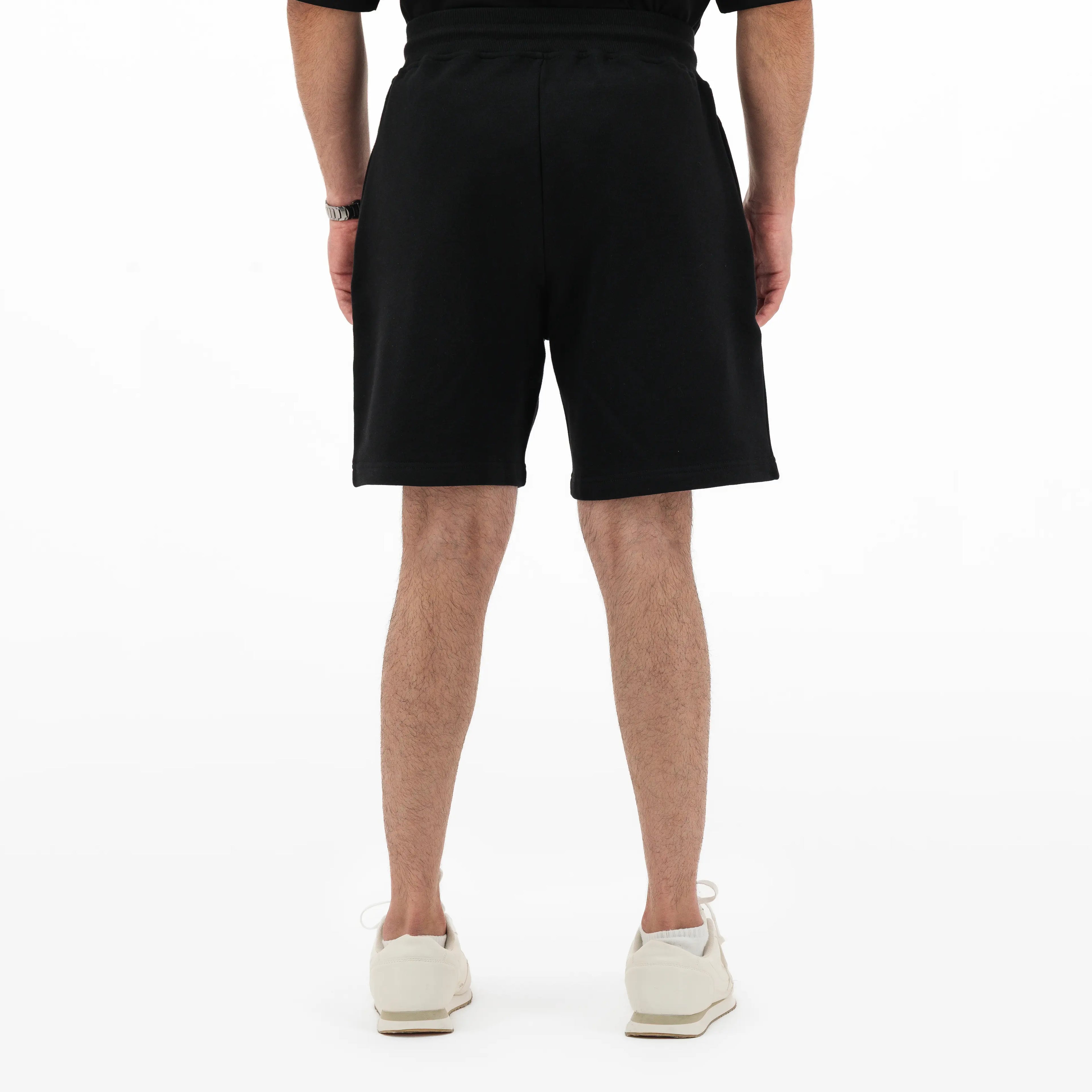 Model wearing black shorts