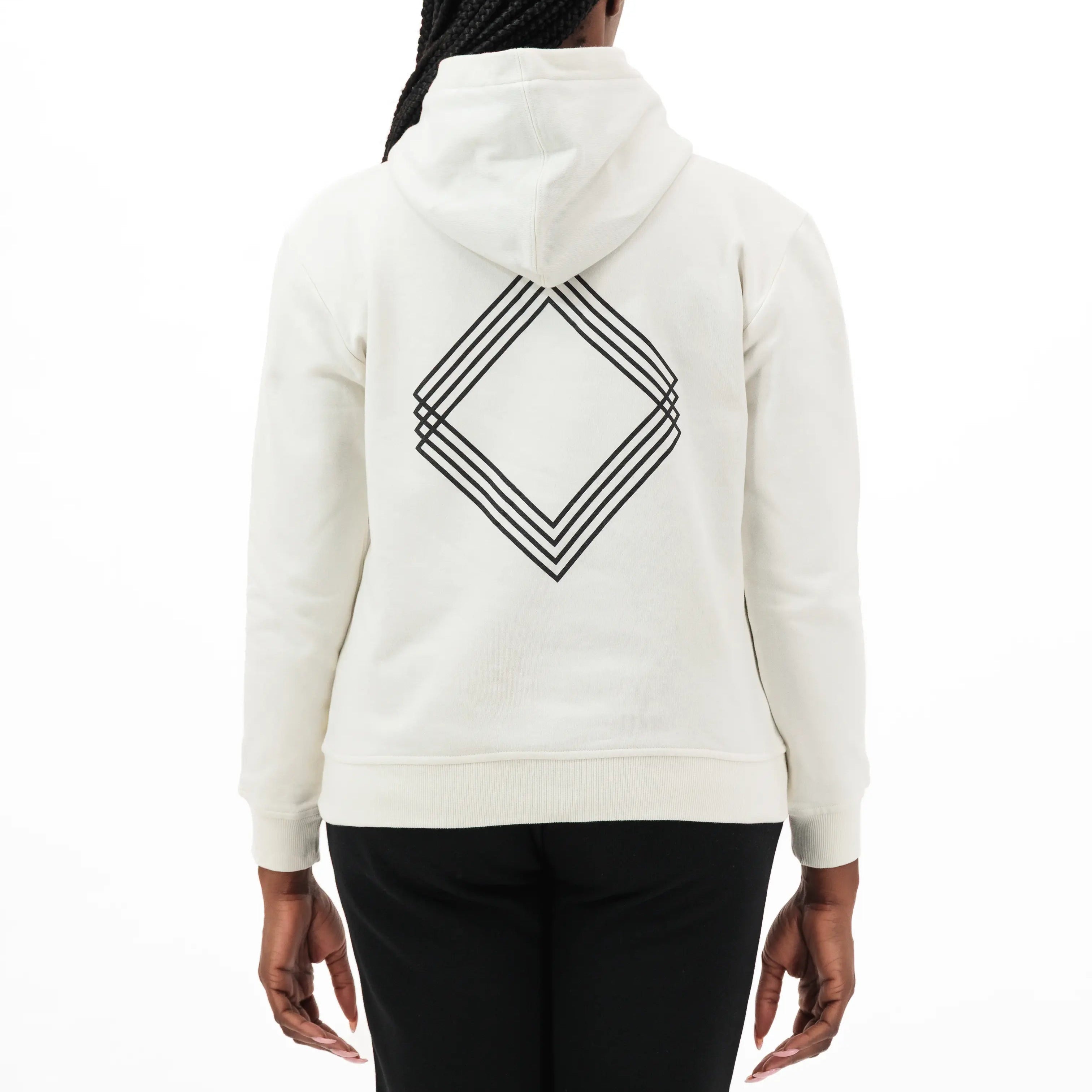 Person wearing white hoodie with black geometric design on the back. #color_white