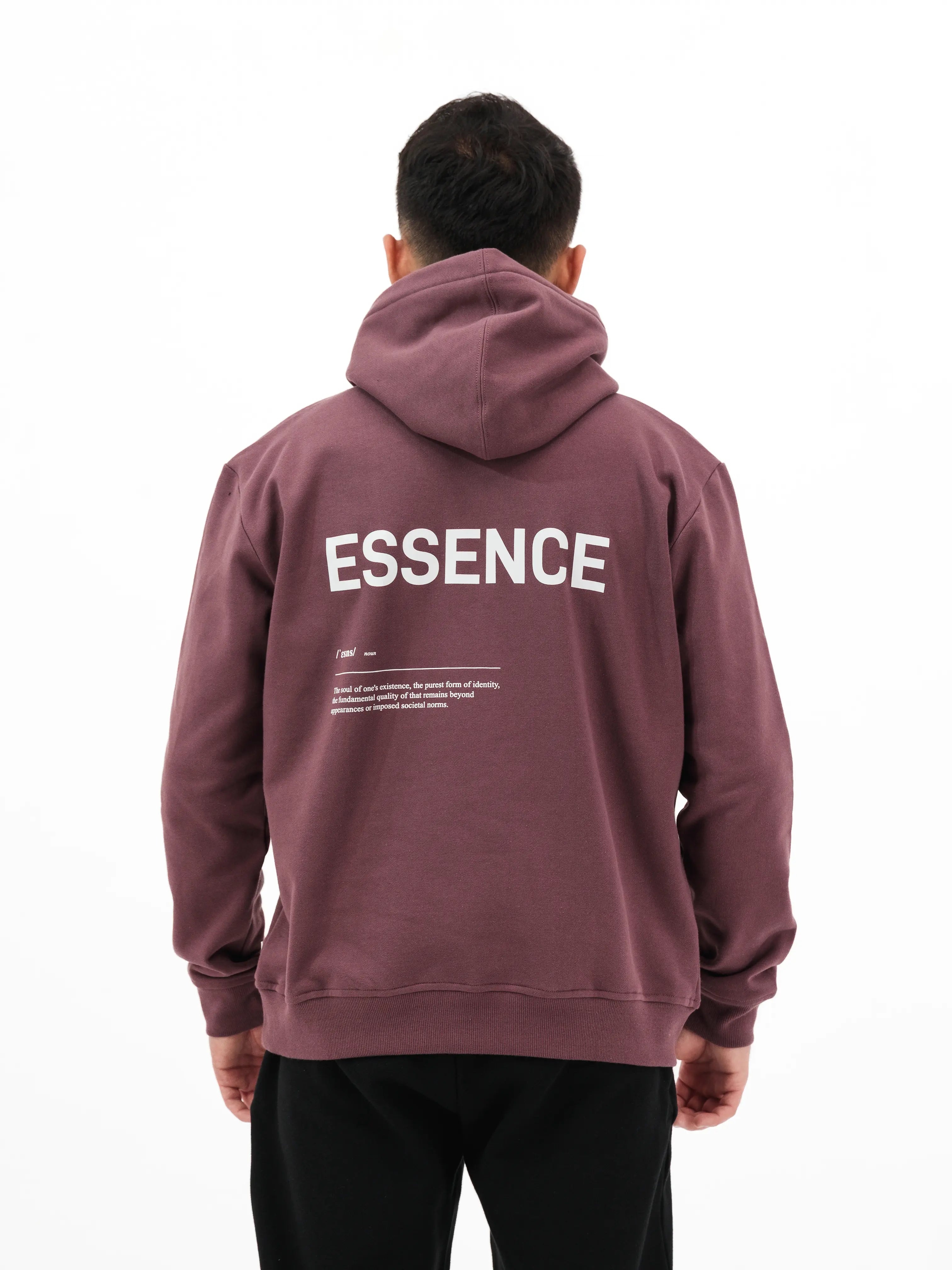Person wearing Unidentity plum hoodie with ESSENCE printed on the back. #color_plum