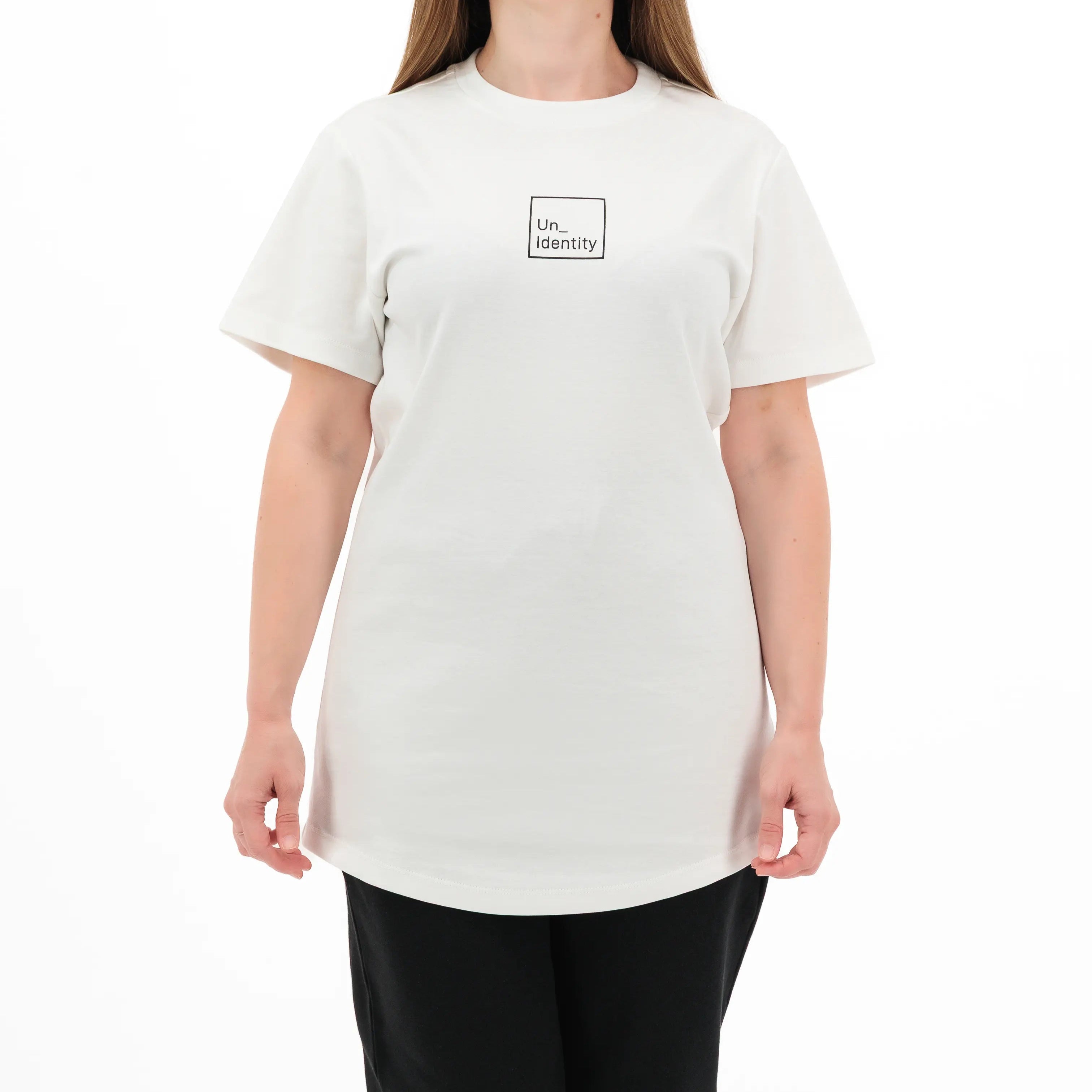 Person wearing white tee with black Unidentity logo on the chest. #color_white
