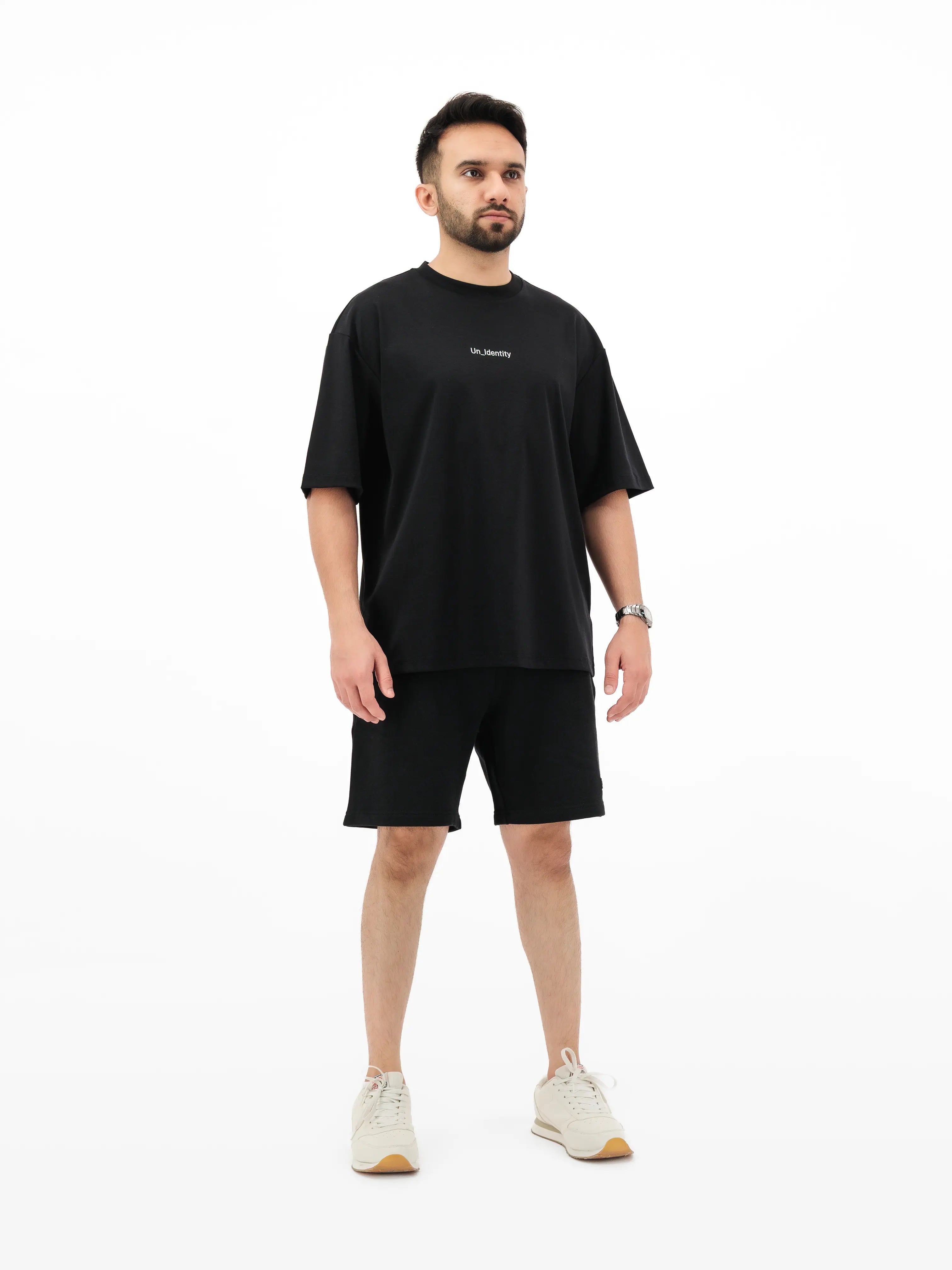 Black Unidentity tee and shorts on model. #color_black