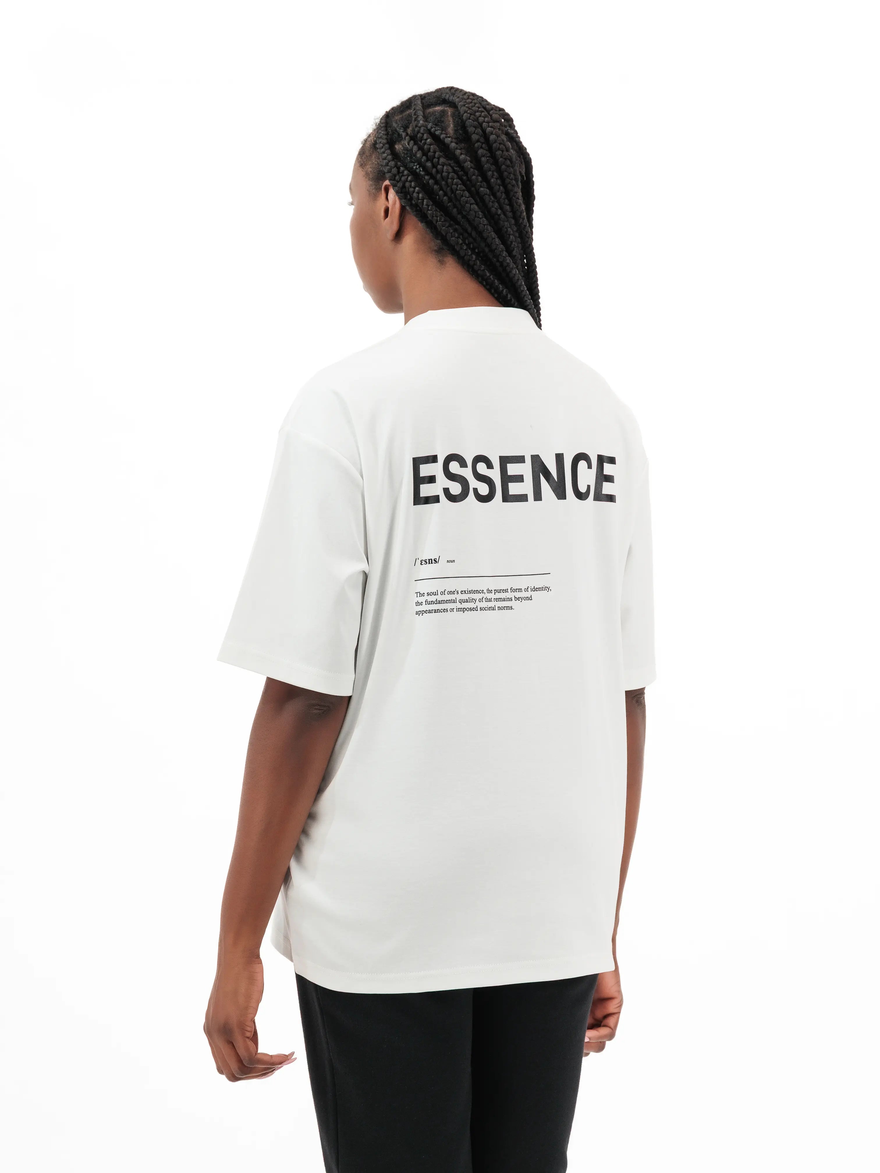Woman wearing white Unidentity T-shirt with ESSENCE printed on the back. #color_white