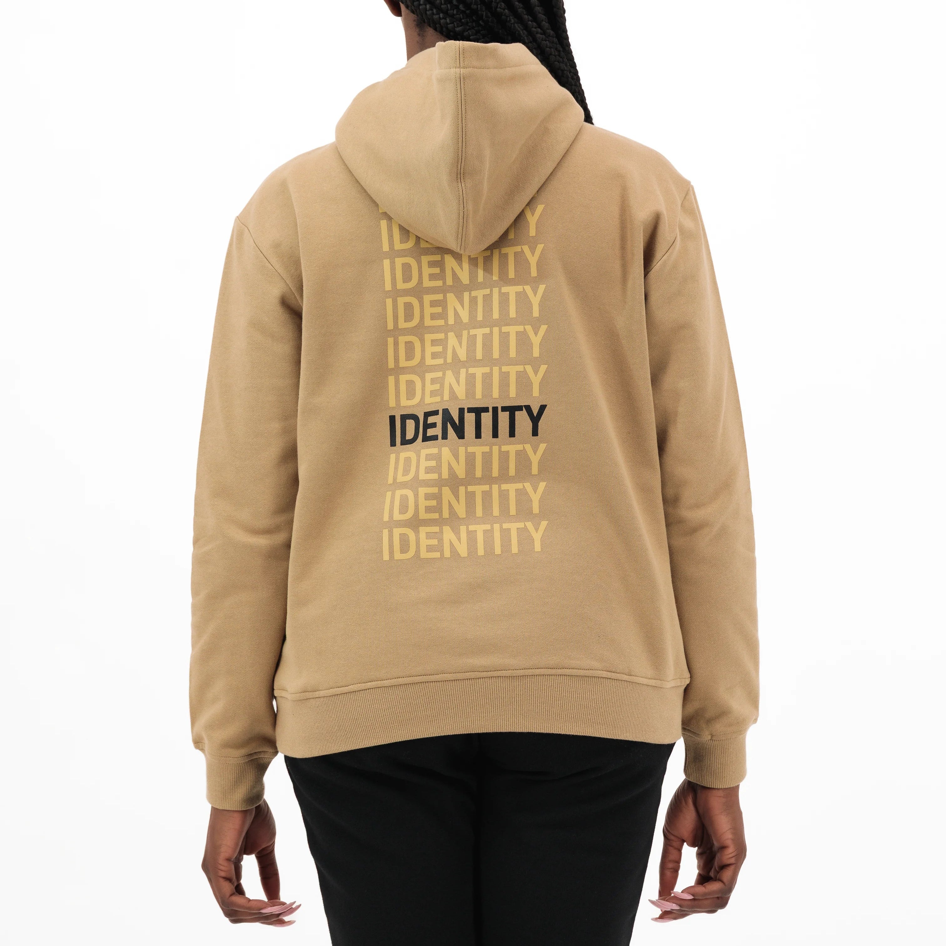 Beige hoodie with identity text on the back on model. #color_beige