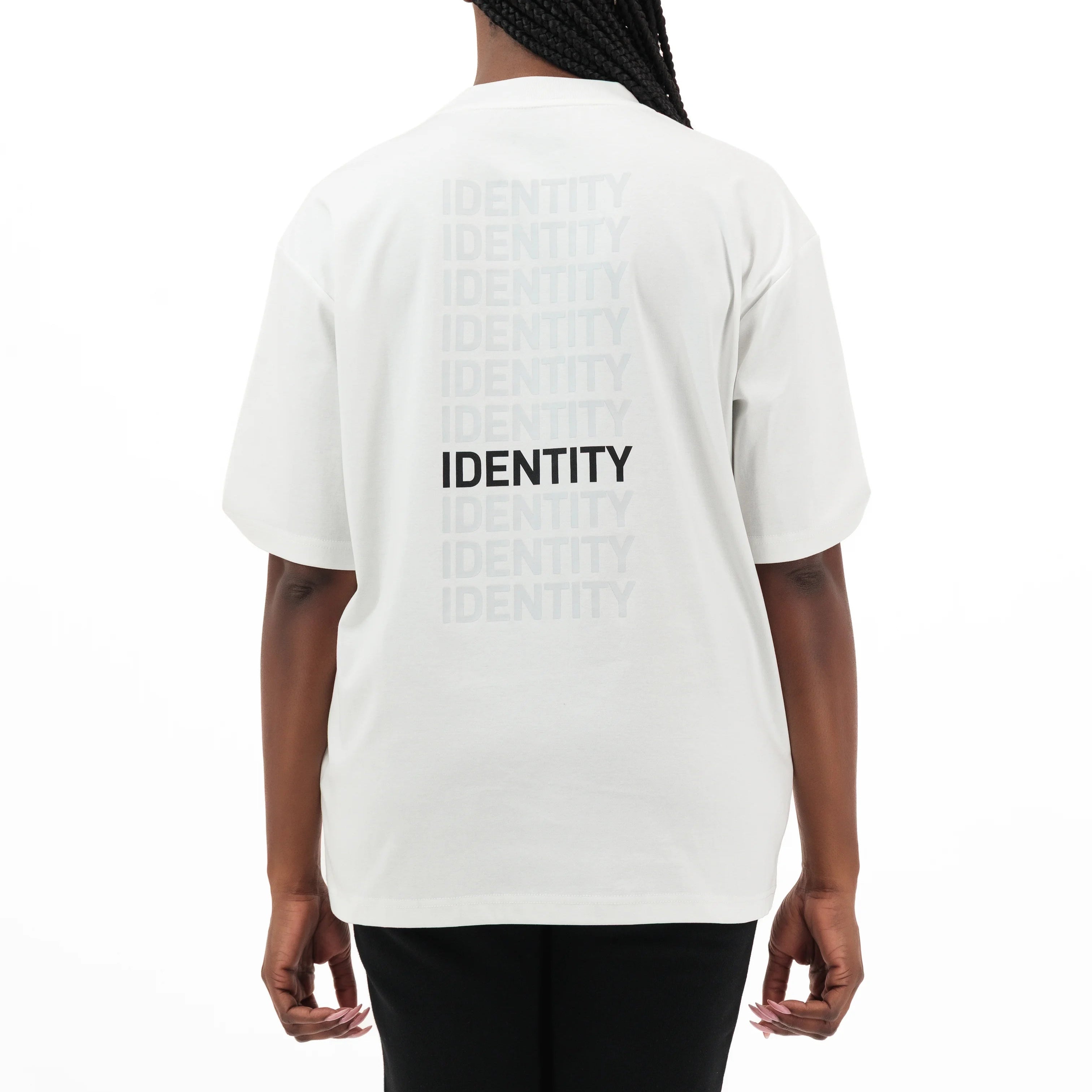 Person wearing white t-shirt with identity printed on the back. #color_white