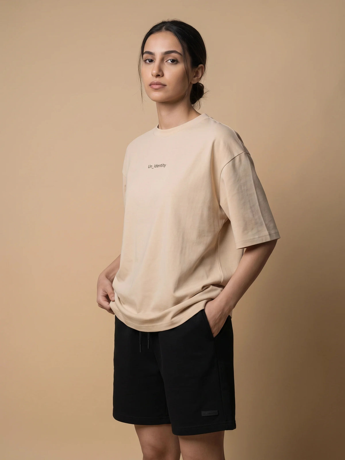 Beige heavyweight oversized t-shirt, Unidentity Soul Tee, front side view worn by woman with black Core shorts, 210gsm #color_beige