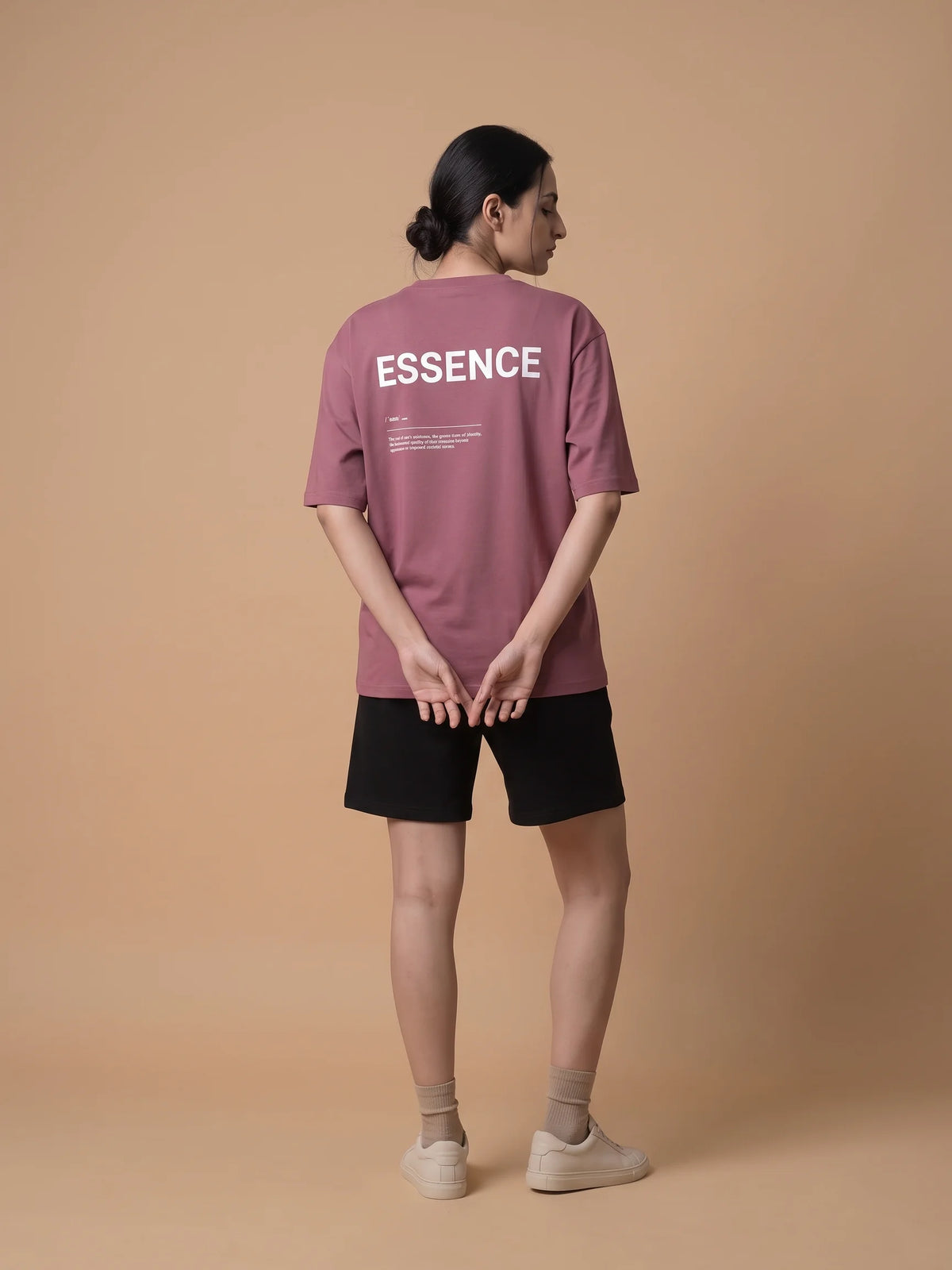 Plum oversized t-shirt in organic cotton, Unidentity Soul Tee, full-length back view of the ESSENCE print worn by woman, streetwear #color_plum