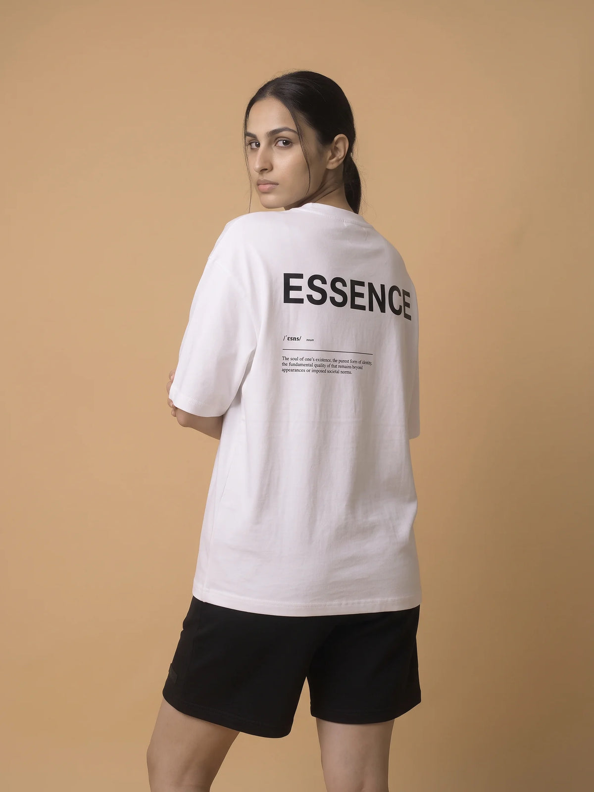 White oversized t-shirt, Unidentity Soul Oversized Tee, back view of the ESSENCE definition print worn by woman glancing over her shoulder, streetwear #color_white