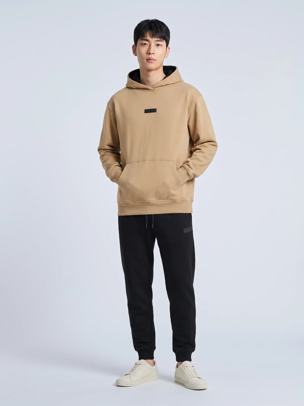 Beige heavyweight hoodie, Unidentity Identity Regular Fit Hoodie, full-length front view with chest patch and hands in kangaroo pocket, 390gsm #color_beige