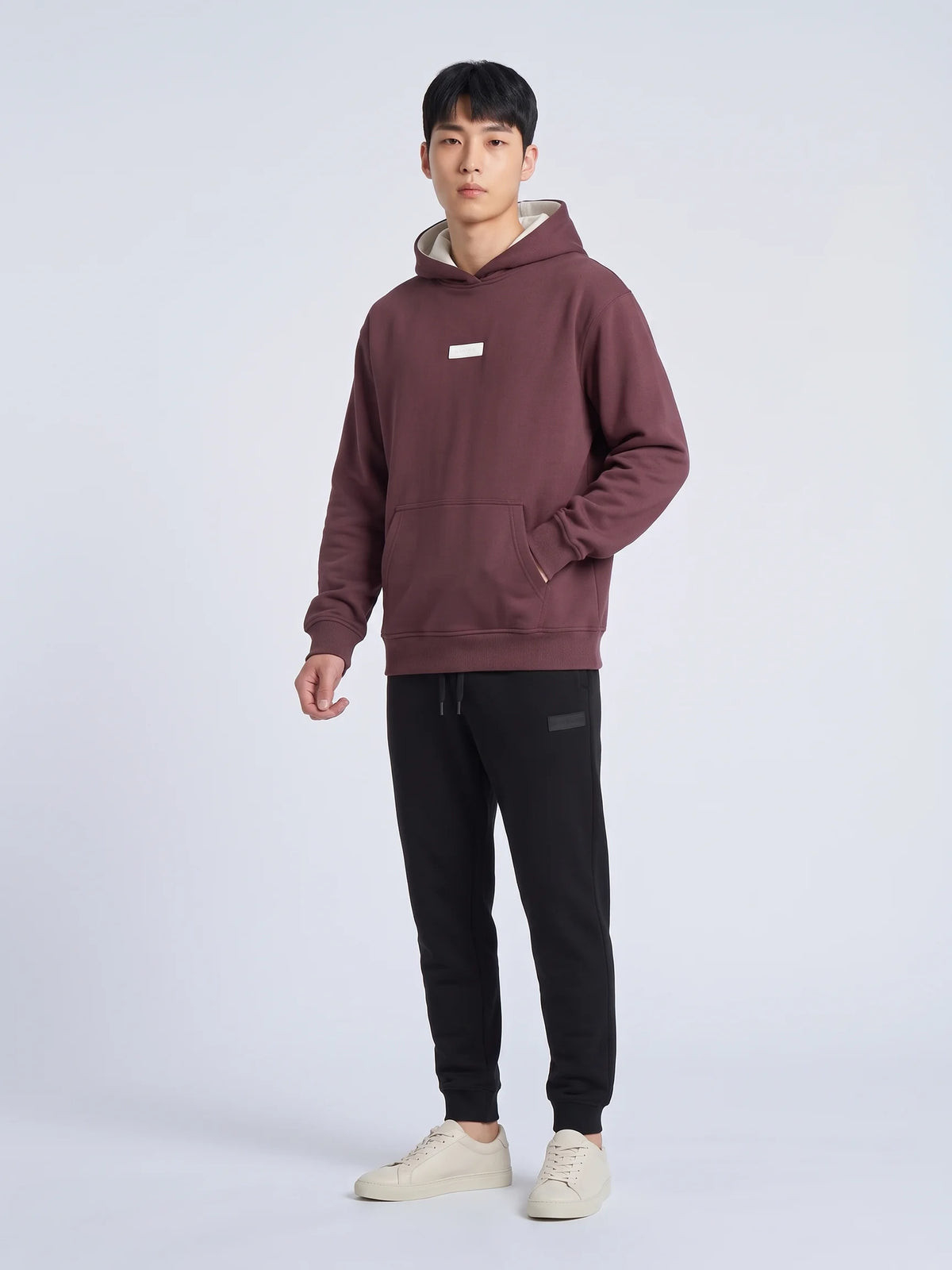 Plum organic cotton hoodie, Unidentity Identity Regular Fit Hoodie, full-length front view with white chest patch, streetwear from Dubai #color_plum