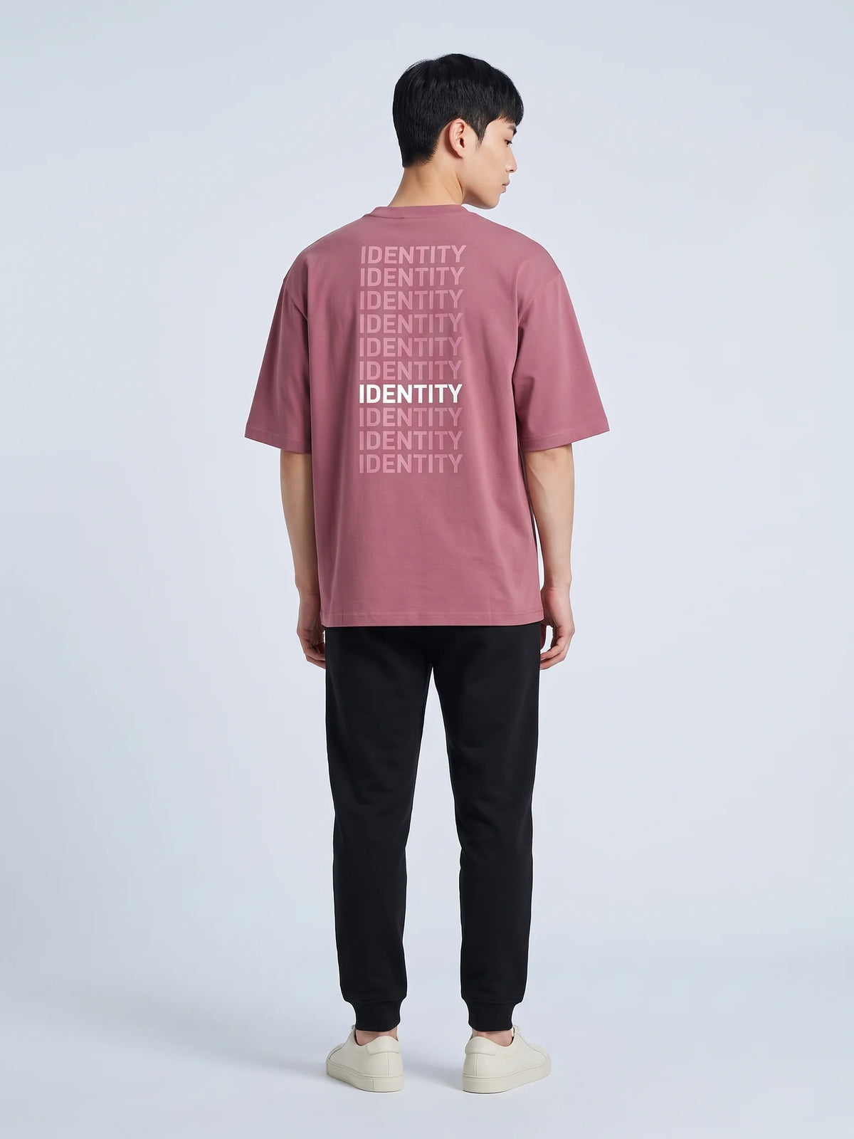 Plum heavyweight oversized t-shirt, Unidentity Identity Tee, full-length back view of the IDENTITY print on a man, sustainable fashion #color_plum
