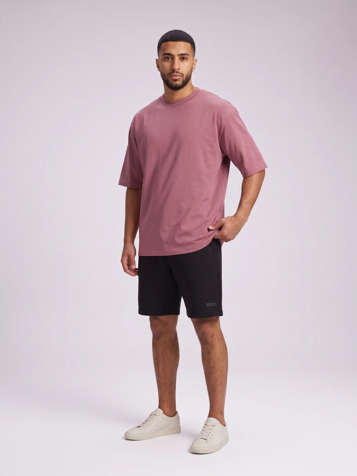 Plum organic cotton t-shirt, Unidentity Foundation Oversized Tee, full-length front view worn by man with black Core shorts, 210gsm streetwear #color_plum