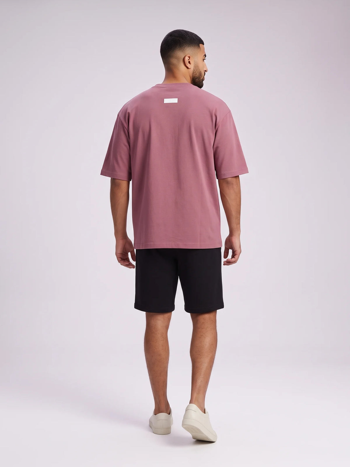 Plum heavyweight oversized t-shirt, Unidentity Foundation Oversized Tee, full-length back view of the boxy cut and 3D patch on a man, 210gsm #color_plum