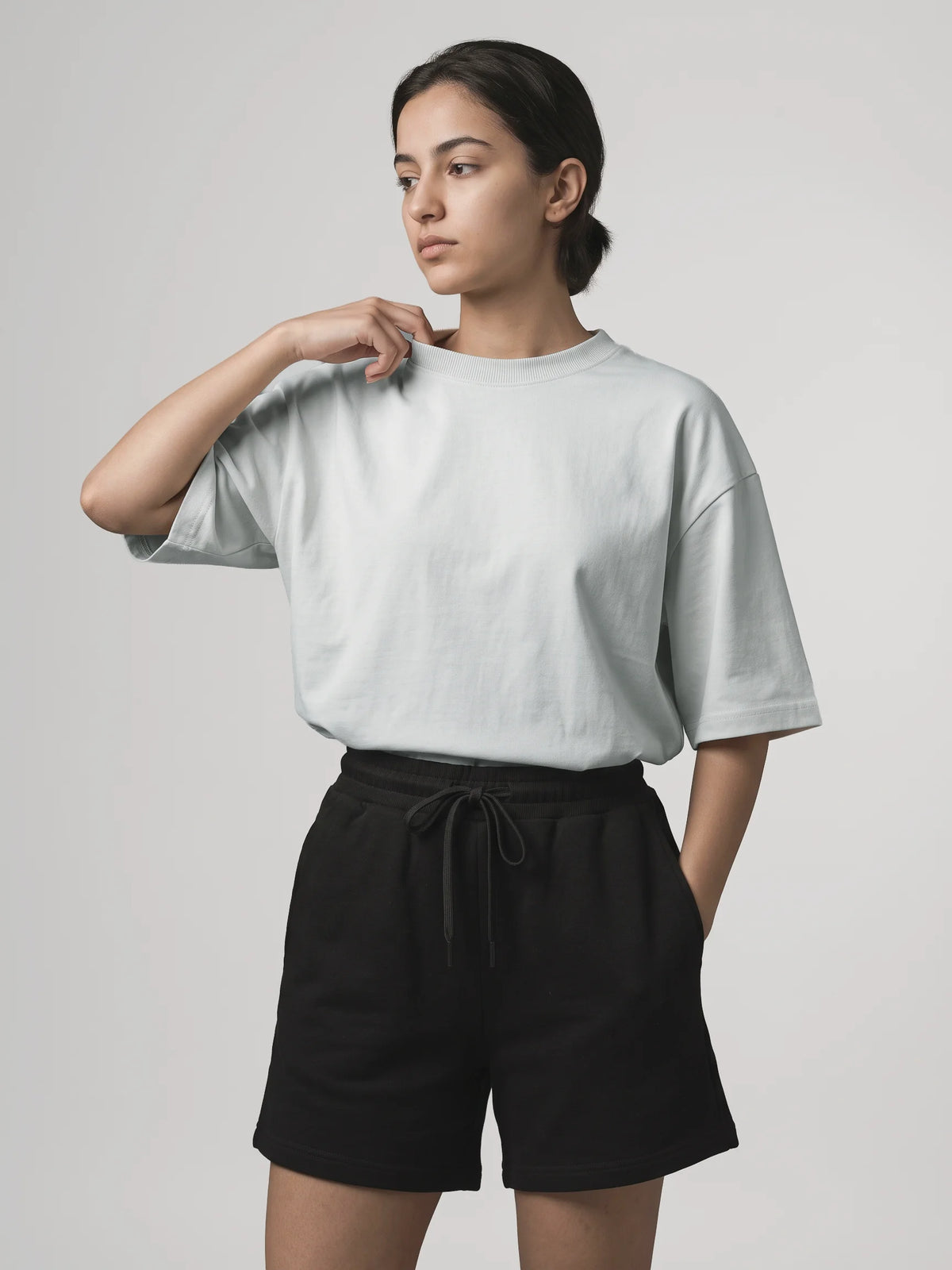 Gray organic cotton t-shirt, Unidentity You Oversized Tee, front view worn by woman with black Core Regular Fit Shorts, sustainable fashion #color_gray