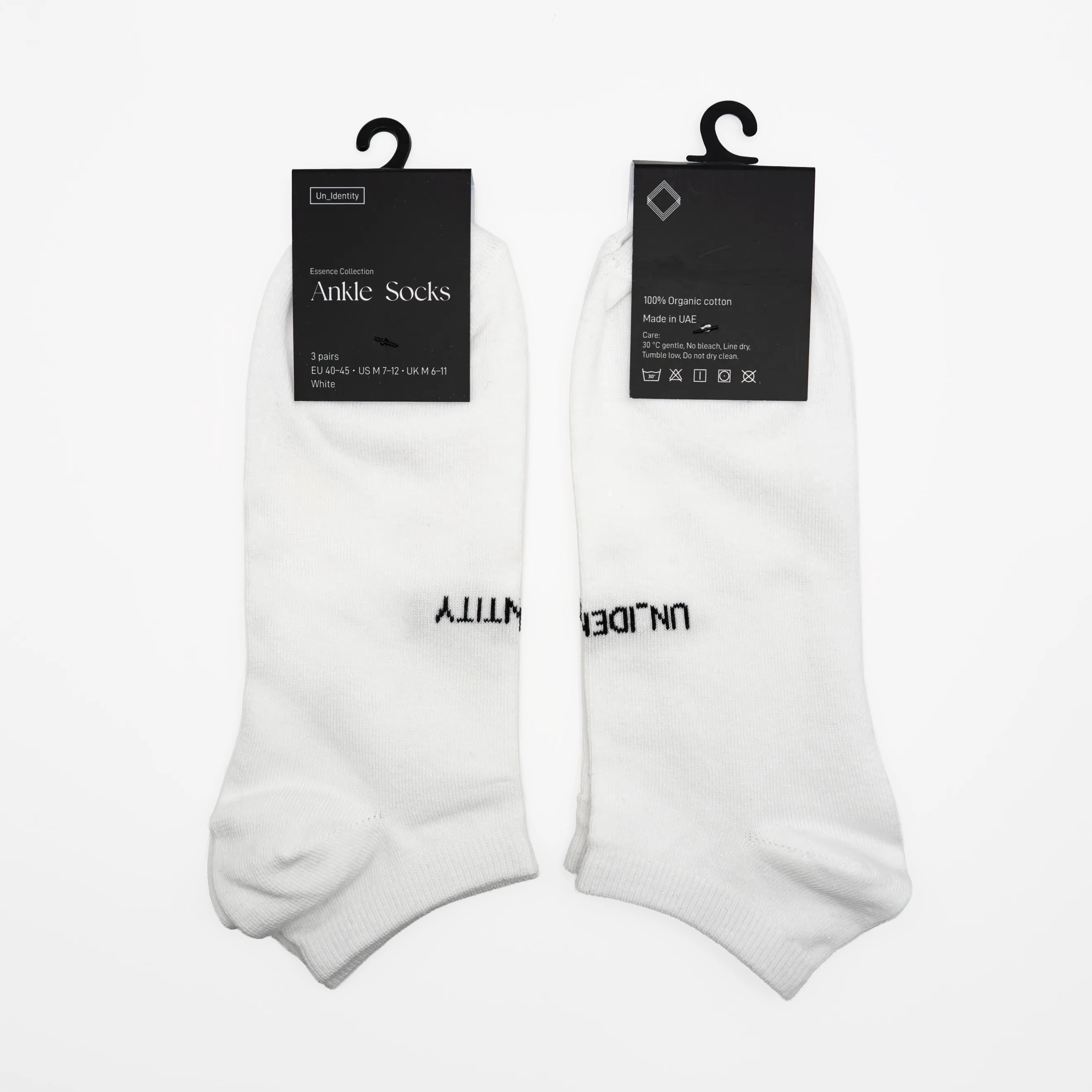 White ankle socks with black text on a white background. #color_white