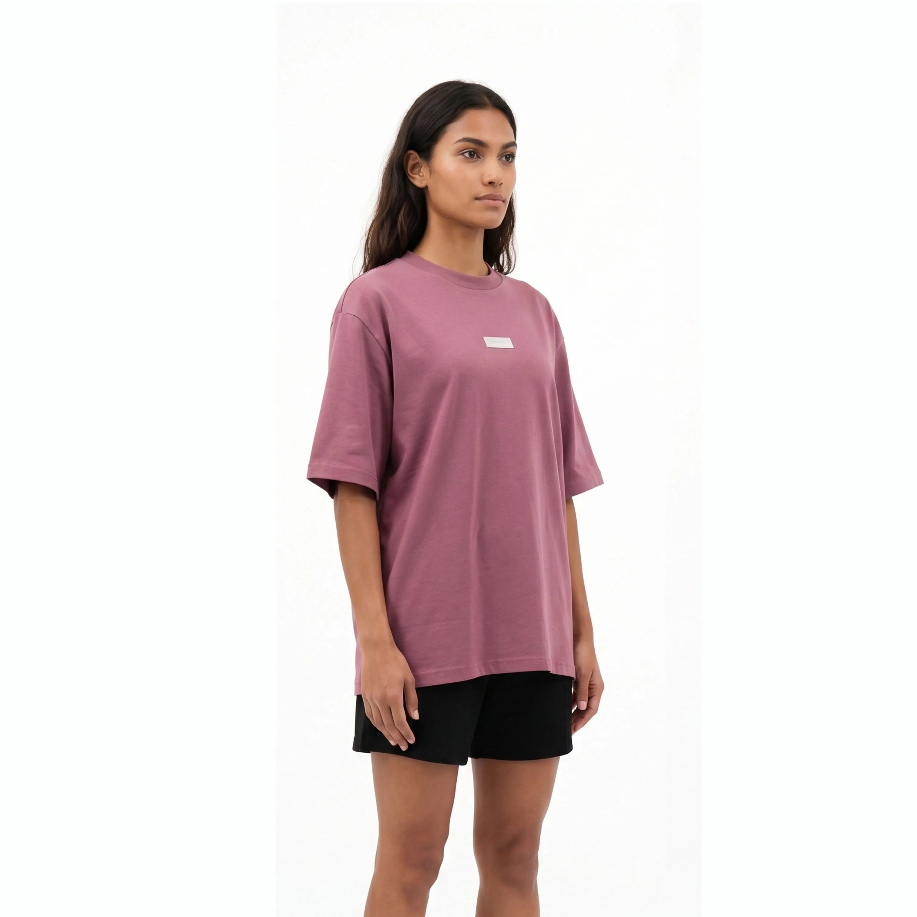 Woman wearing Unidentity plum tee and black shorts. #color_plum