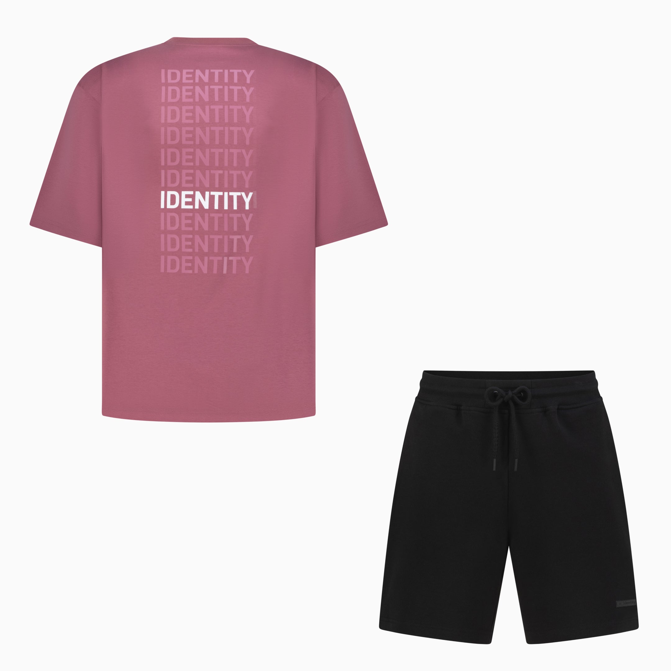 Pink tee with identity text on the back and black shorts 