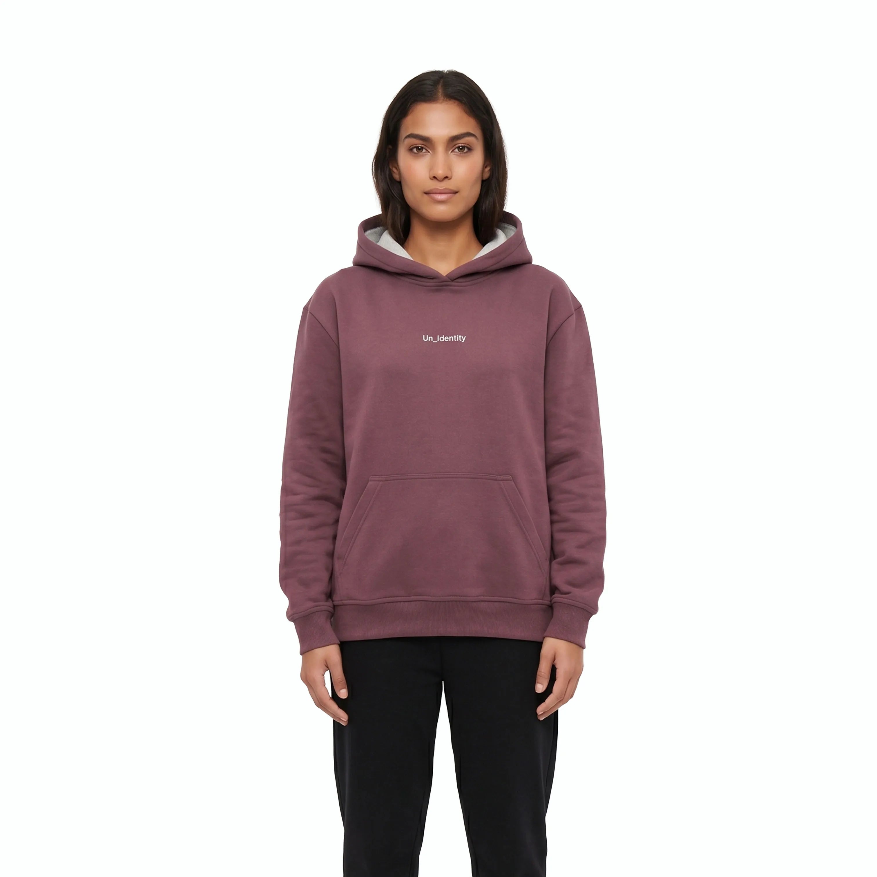 Woman wearing plum hoodie and black pants. #color_plum