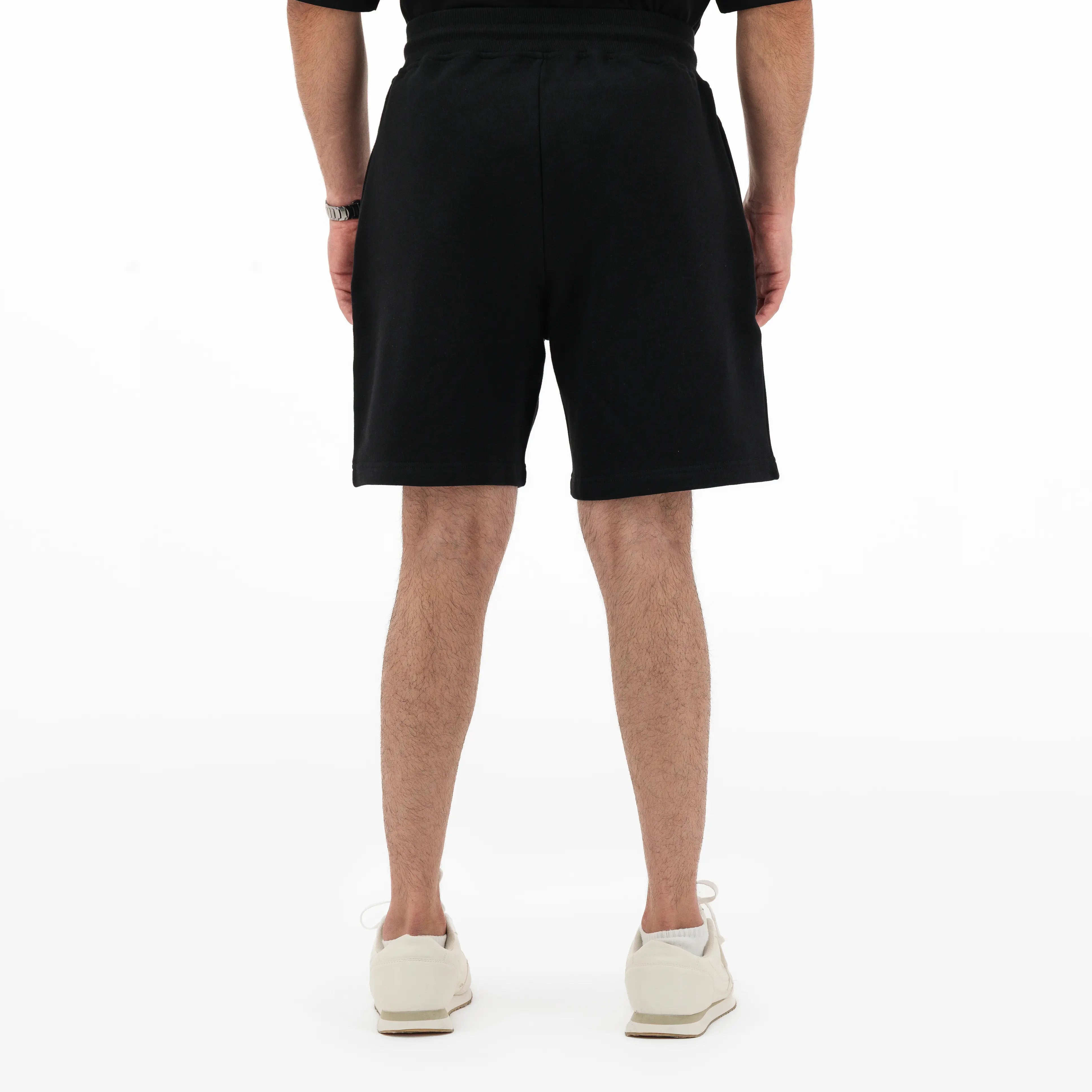 Model wearing black shorts 