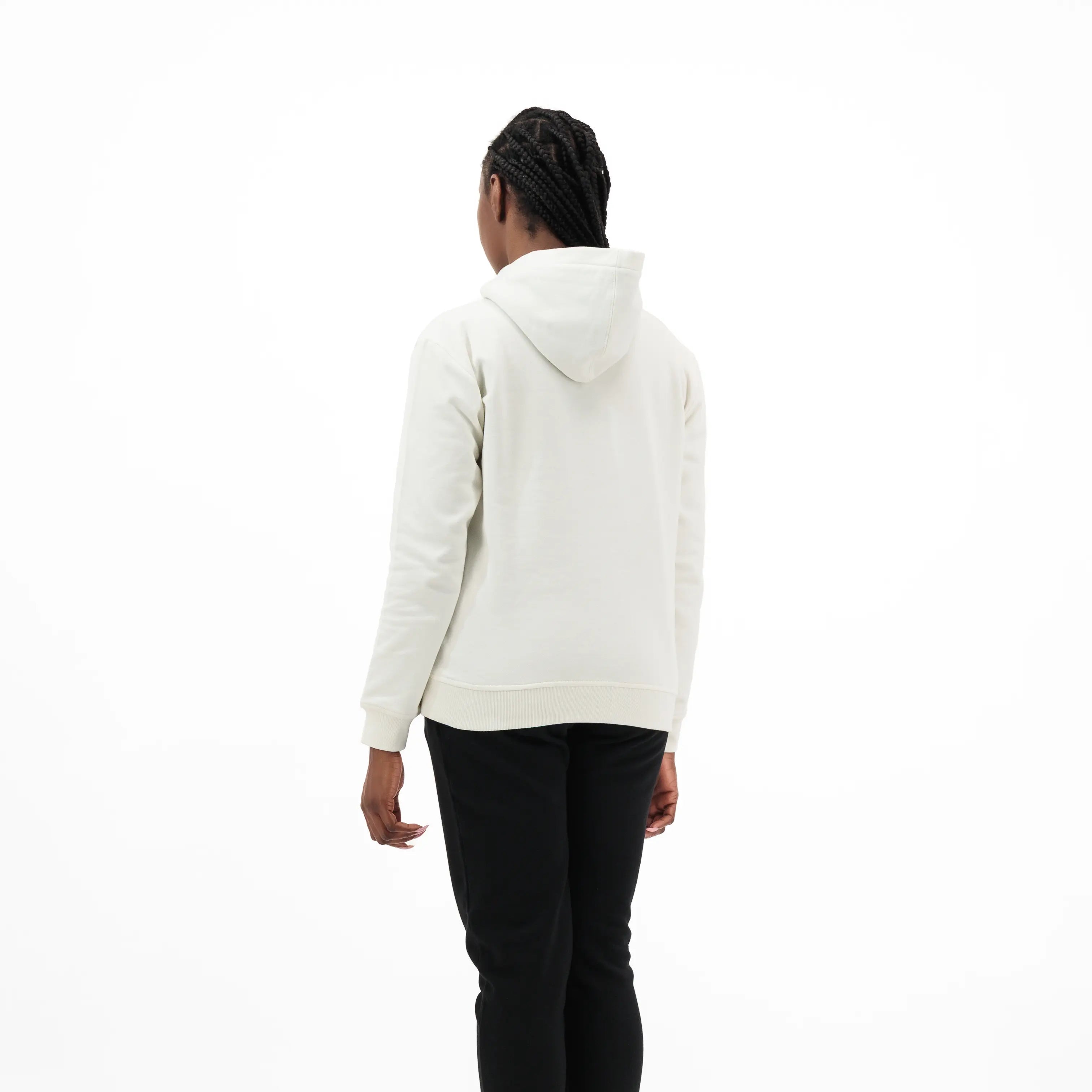 Person wearing white hoodie and black pants. #color_white
