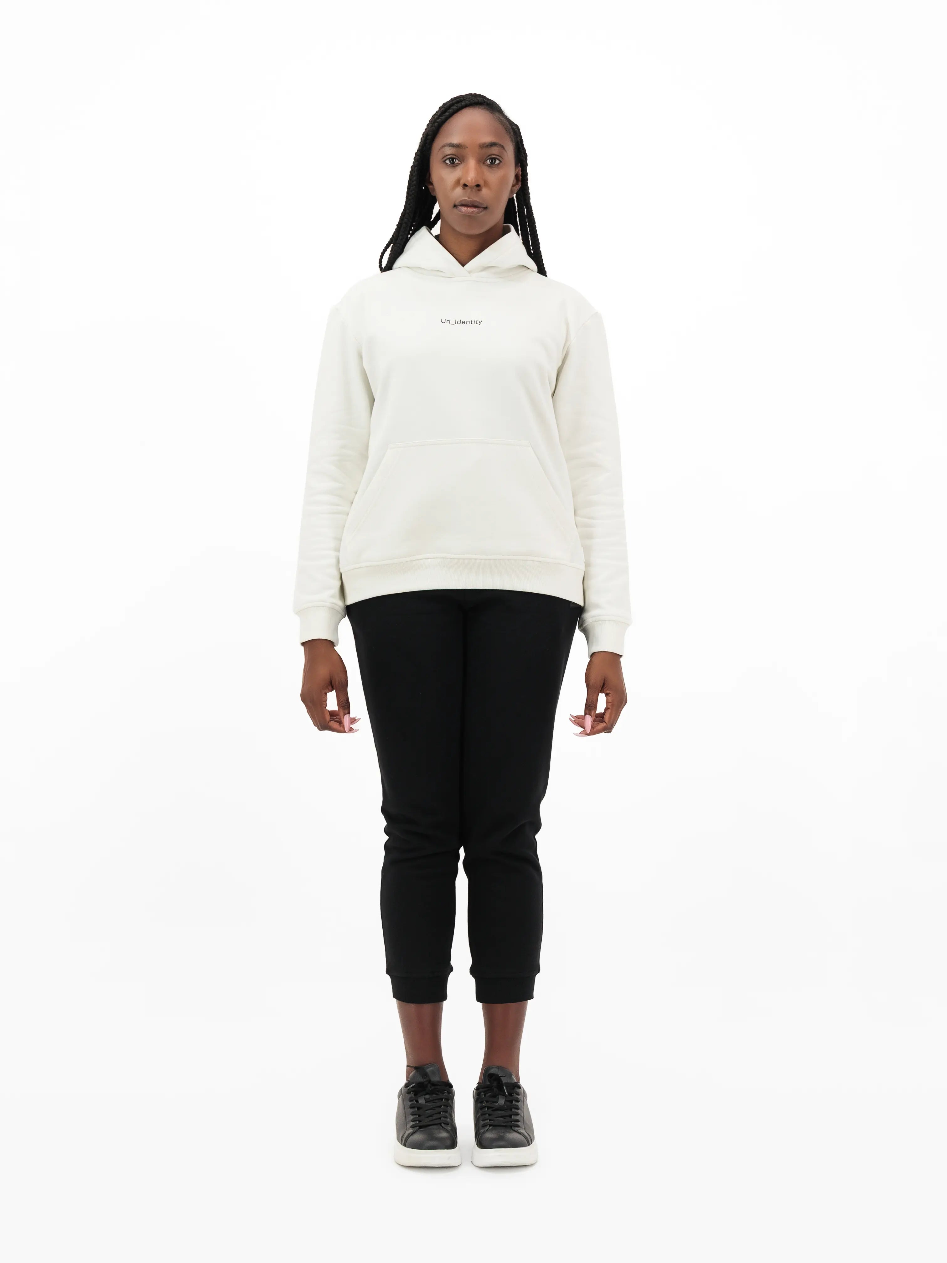 Woman wearing white Unidentity hoodie and black pants. #color_white