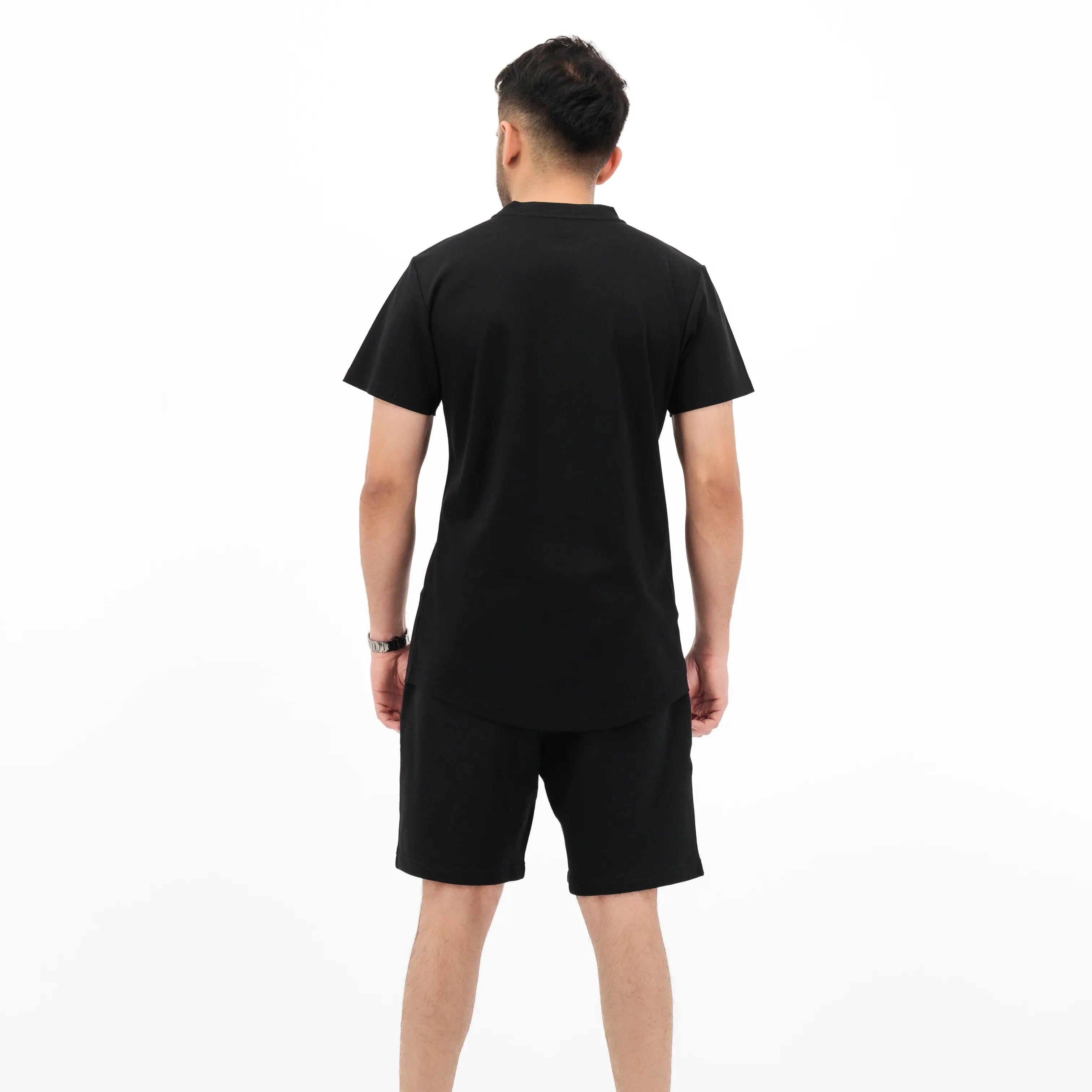 Black tee on model, back part. #color_black