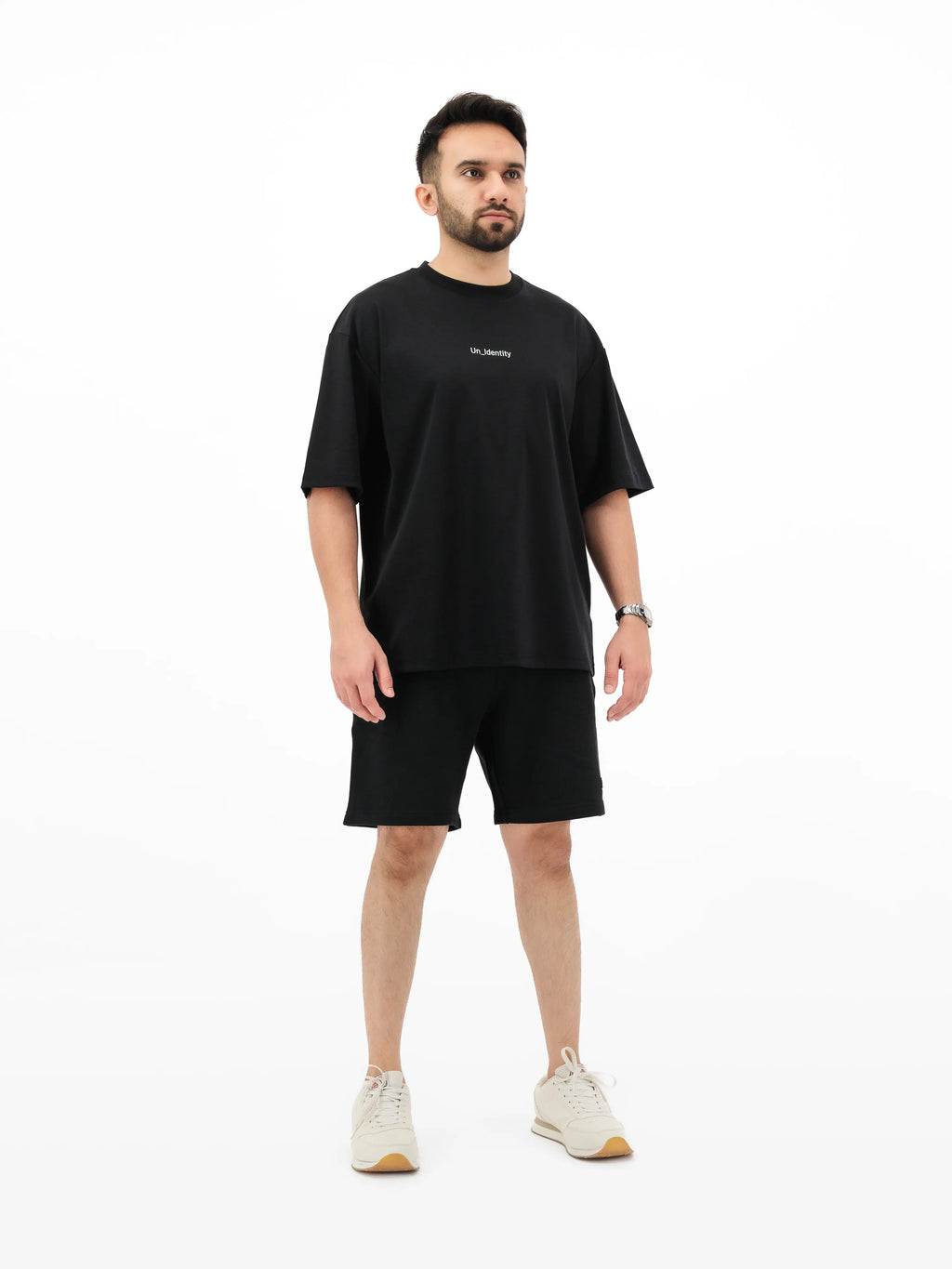 Black Unidentity tee and shorts on model