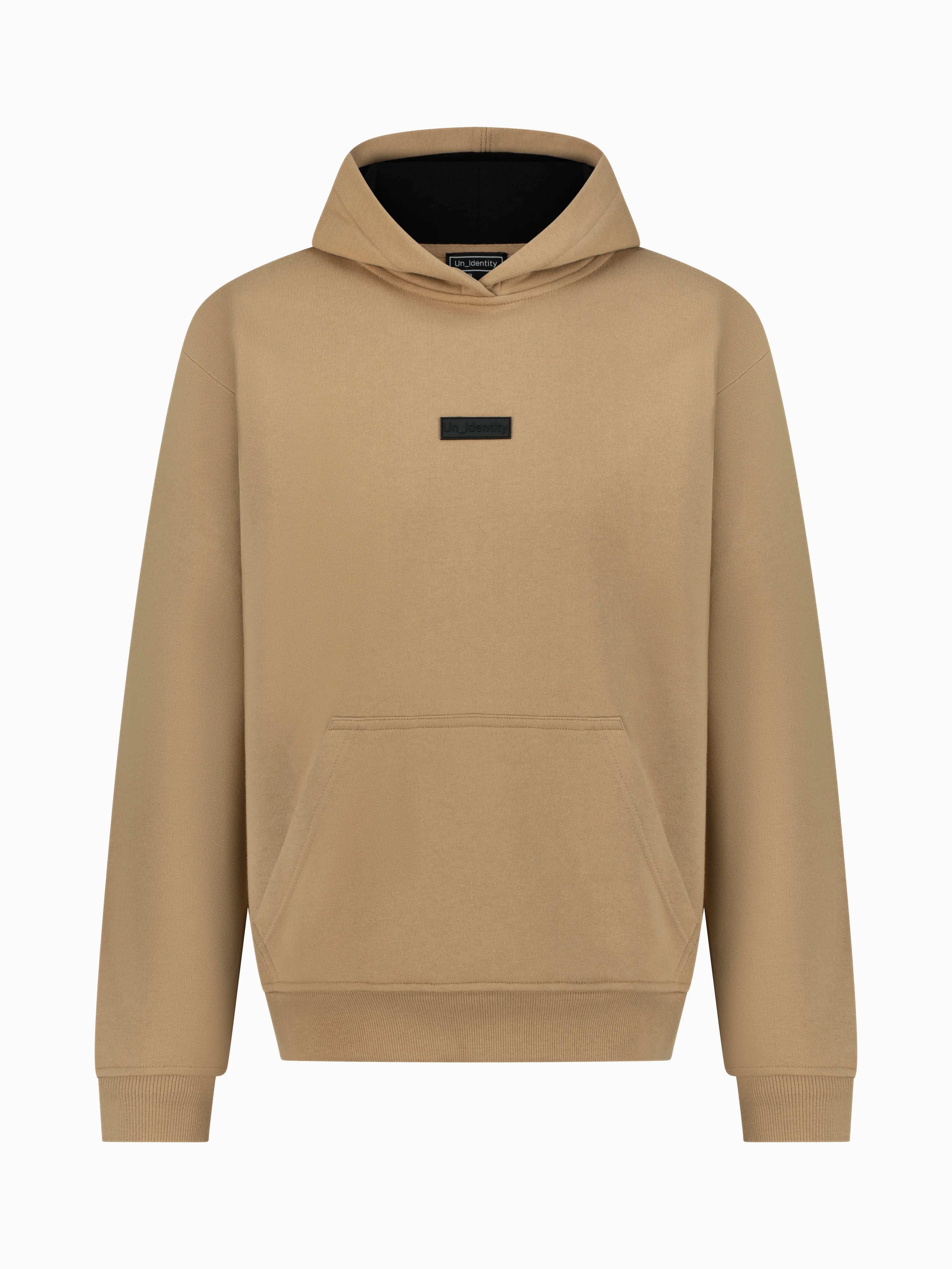 Beige hoodie with small black Unidentity logo on the chest 