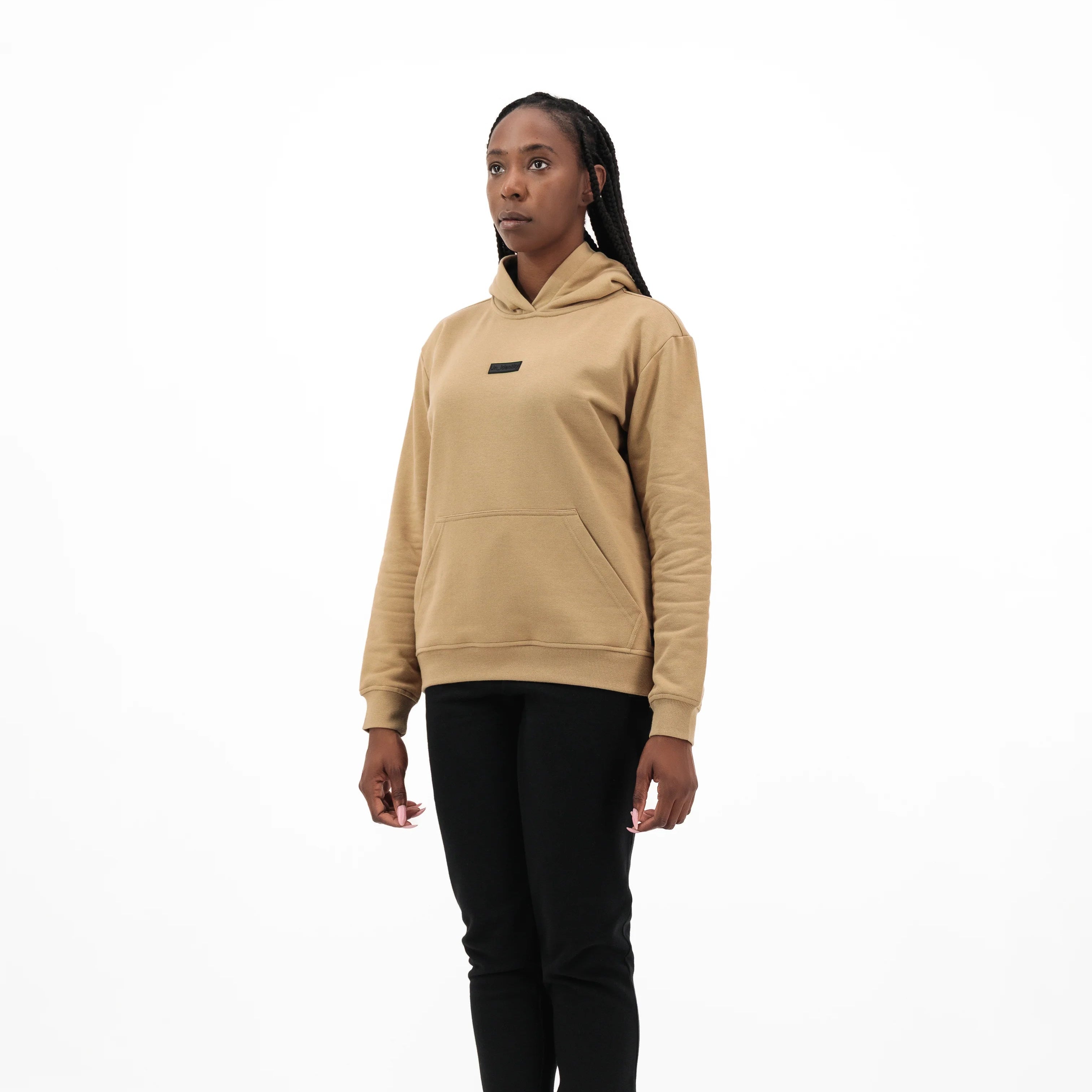 Woman wearing beige Unidentity hoodie and black pants. #color_beige