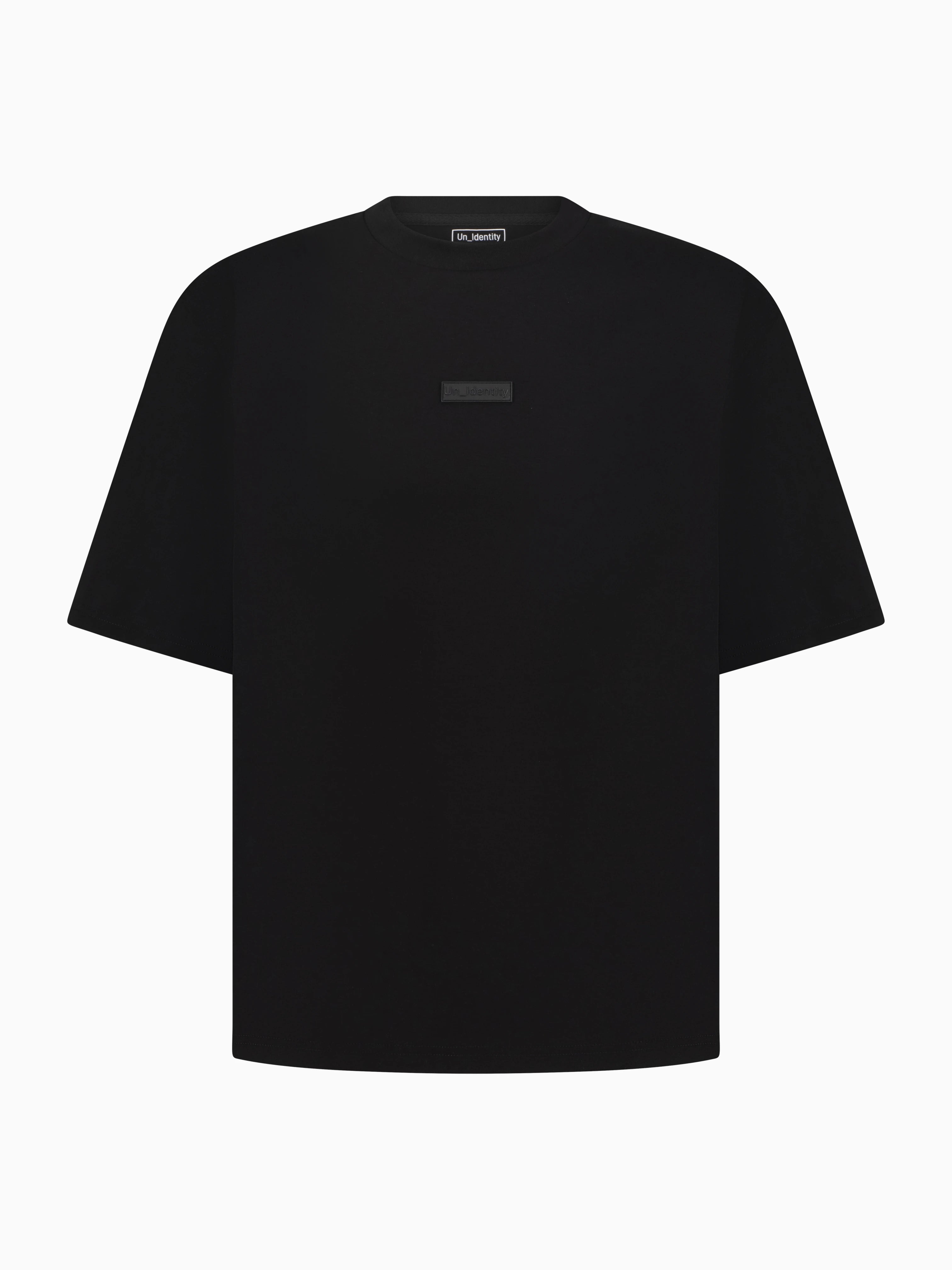 Black Unidentity tee with tonal 3D logo patch on the chest. #color_black