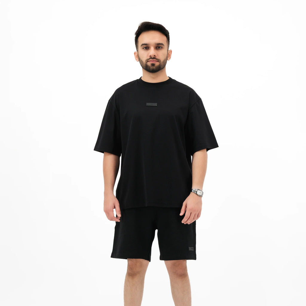 Man wearing black Unidentity t-shirt and shorts set 