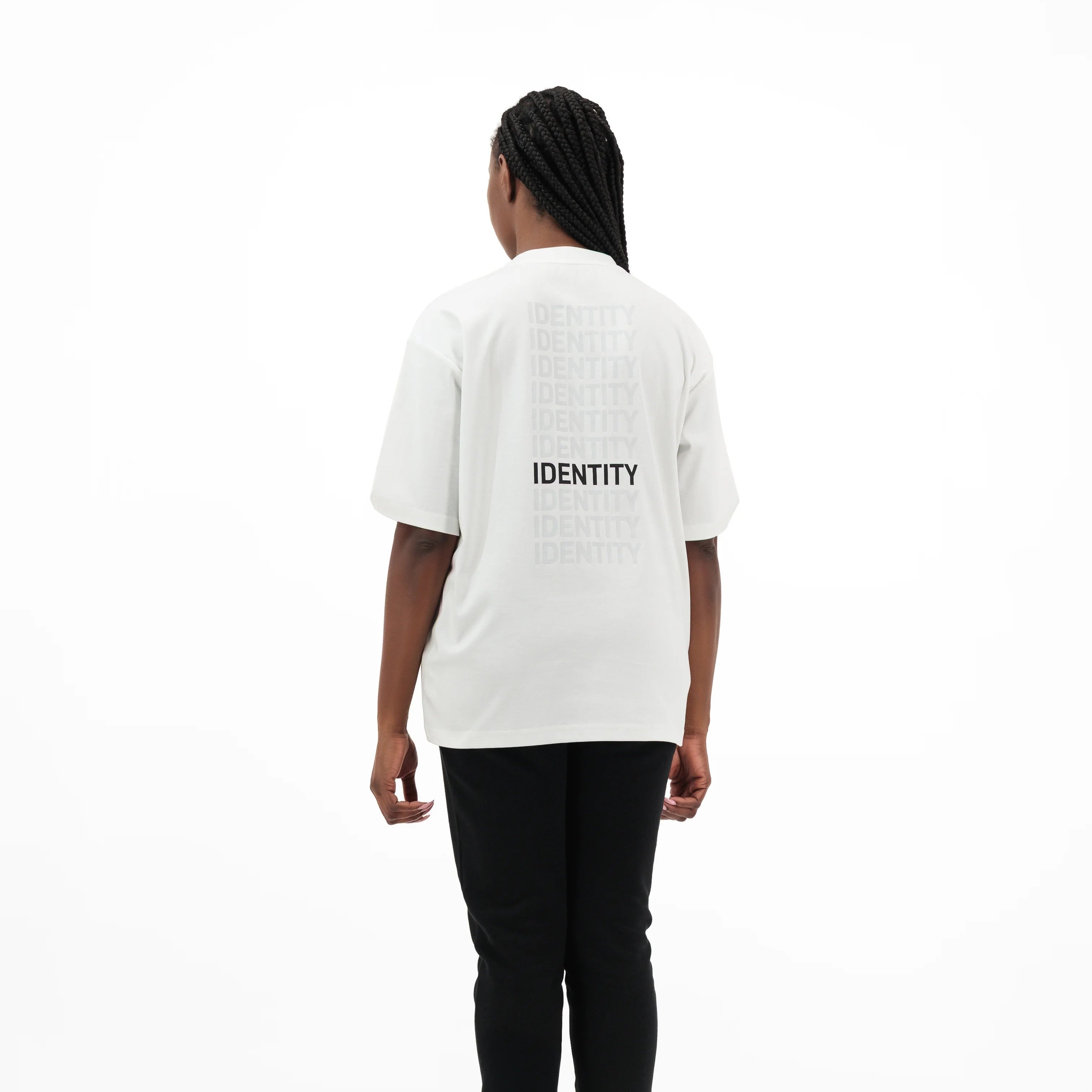 Model wearing white t-shirt with identity printed on the back