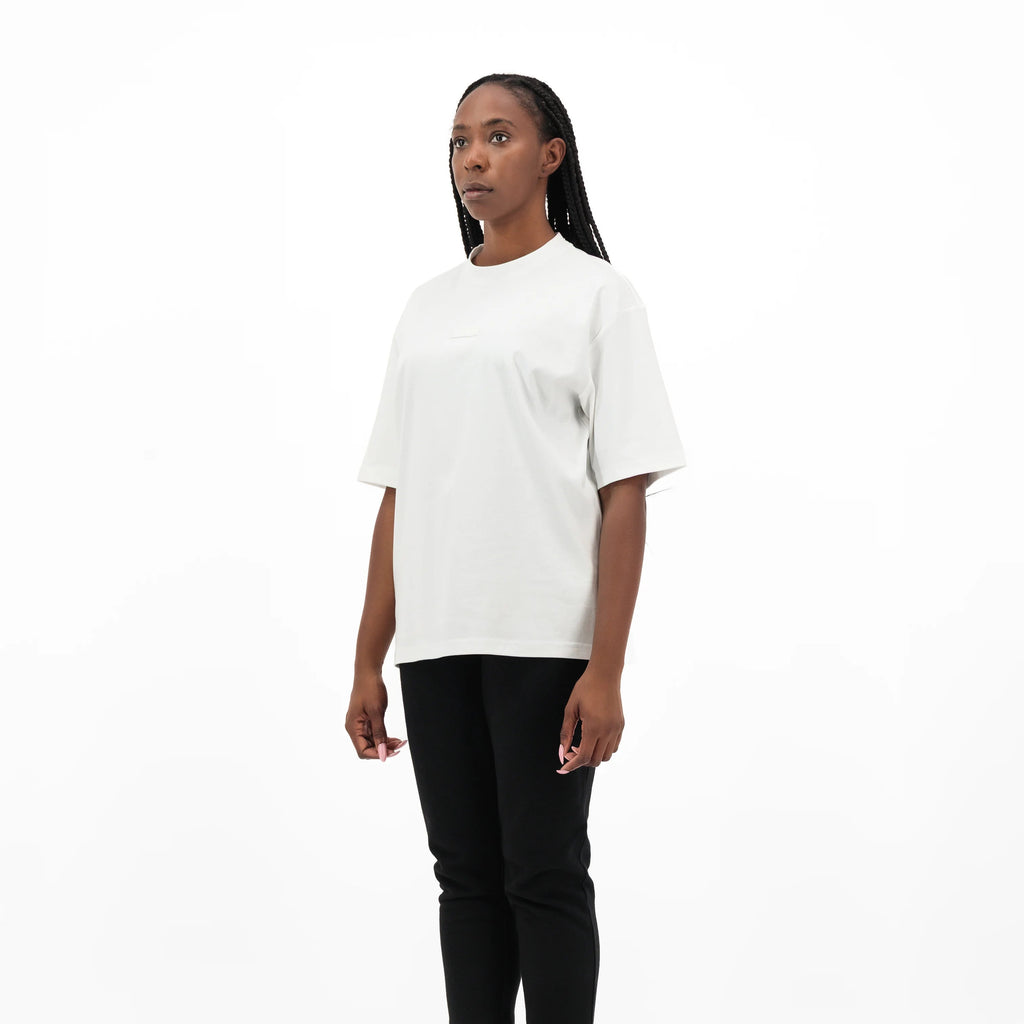 Woman wearing white t-shirt and black pants 